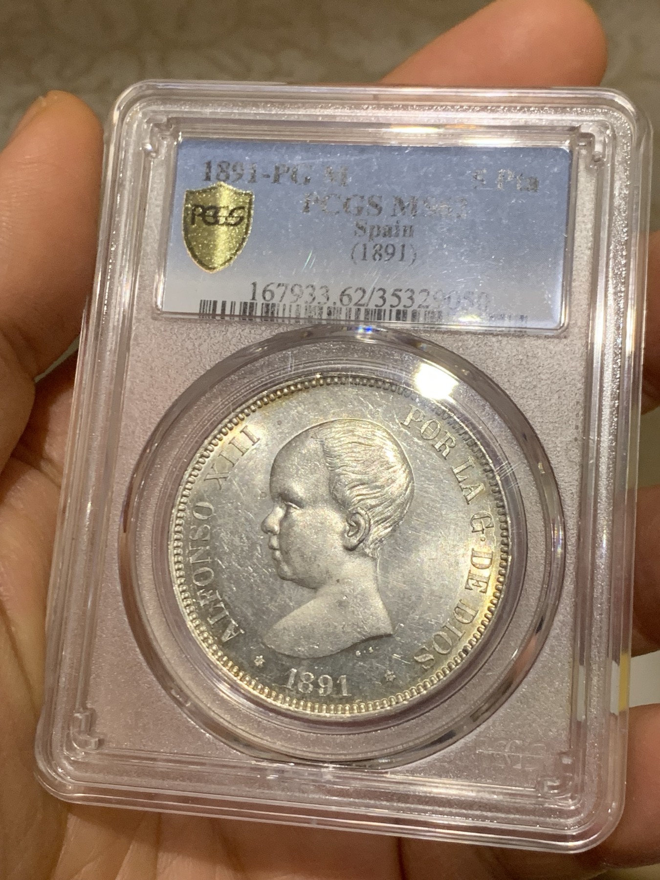 《竞宝斋》圣诞专辑  第一场  第227场 定制纪念章相赠 (全场顺丰包邮) PCGS-MS62 西班牙阿方索十三世小光头5比塞塔银币 1891相对少见年份MS好品不多 原光好品 低评状态 盒子背面下沿有小磕