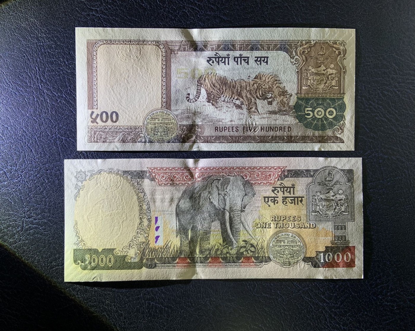 收藏联盟Quantum Auction 第313期拍卖  尼泊尔2002年5到1000卢比 品相UNC 1000卢比边角微瑕，10卢比为纪念钞