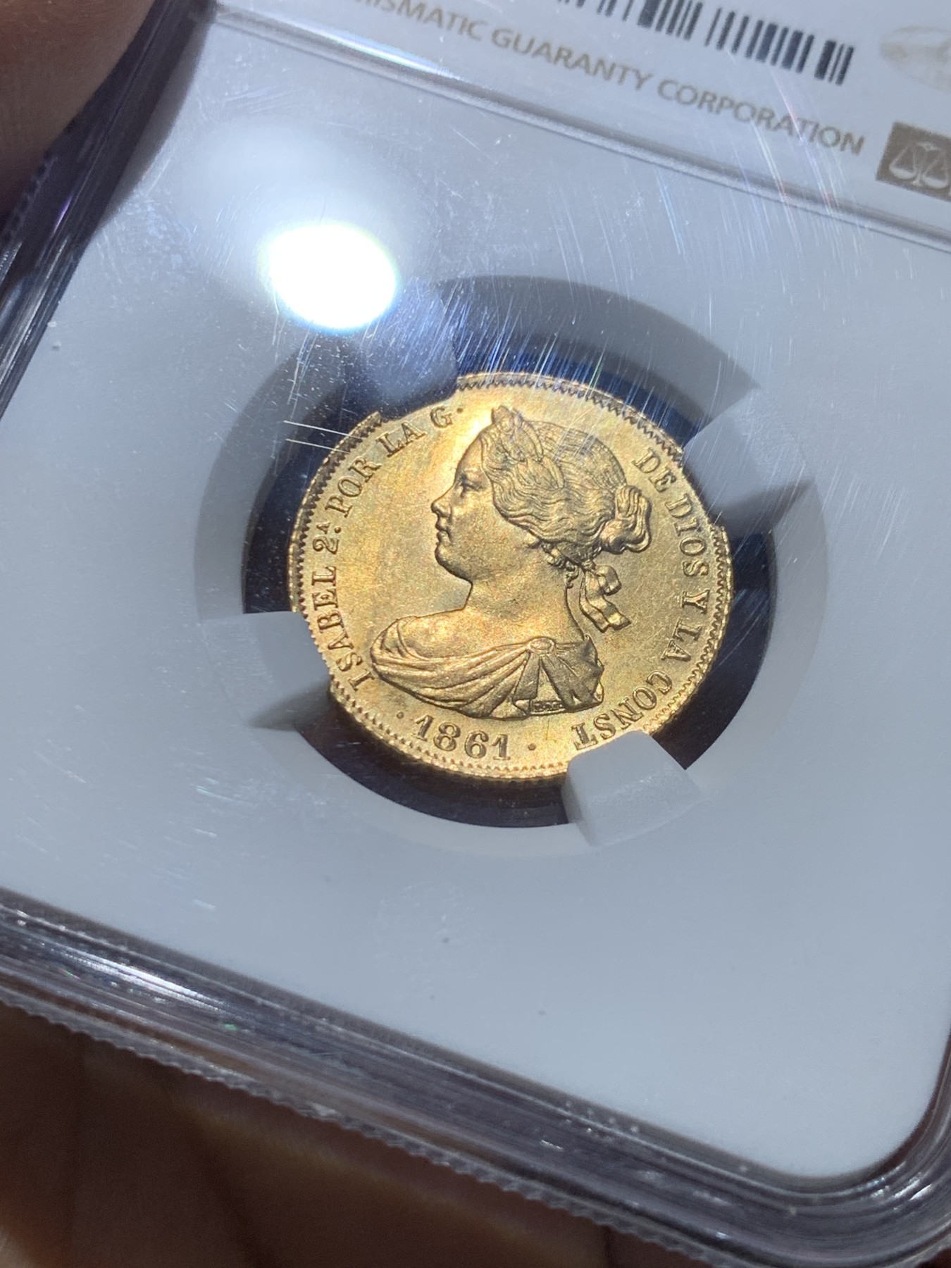 《竞宝斋》圣诞专辑  第一场  第227场 定制纪念章相赠 (全场顺丰包邮) NGC-MS64 西班牙 1861年 伊莎贝拉二世女王 马德里造100R金币（小猪妹） 难得一见的顶级品种 不容错过