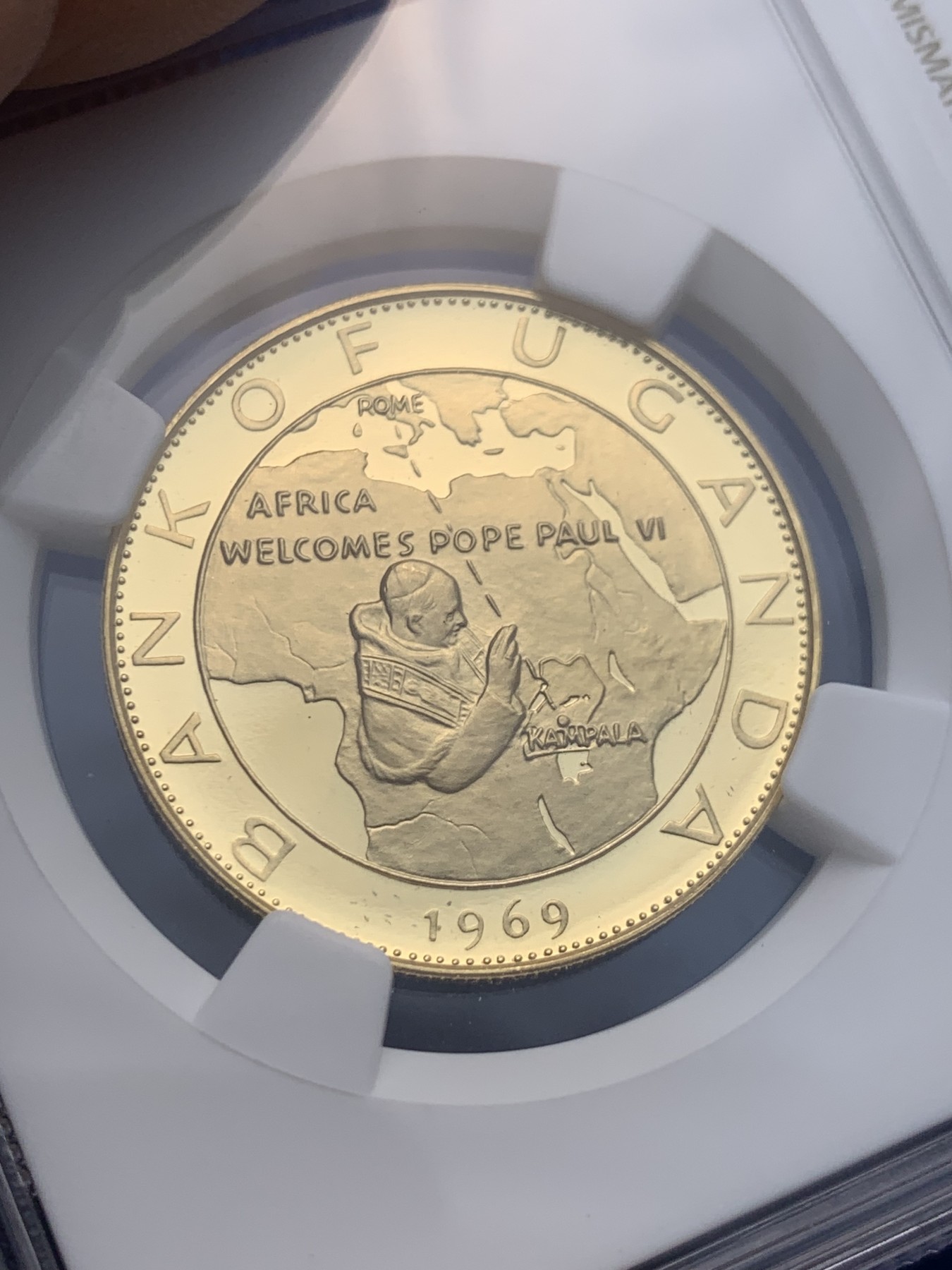 《竞宝斋》圣诞专辑  第一场  第227场 定制纪念章相赠 (全场顺丰包邮) NGC-PF69 UC 1969年乌干达100先令保罗六世到访金币   直径30MM 13.82克 900金 完美品相