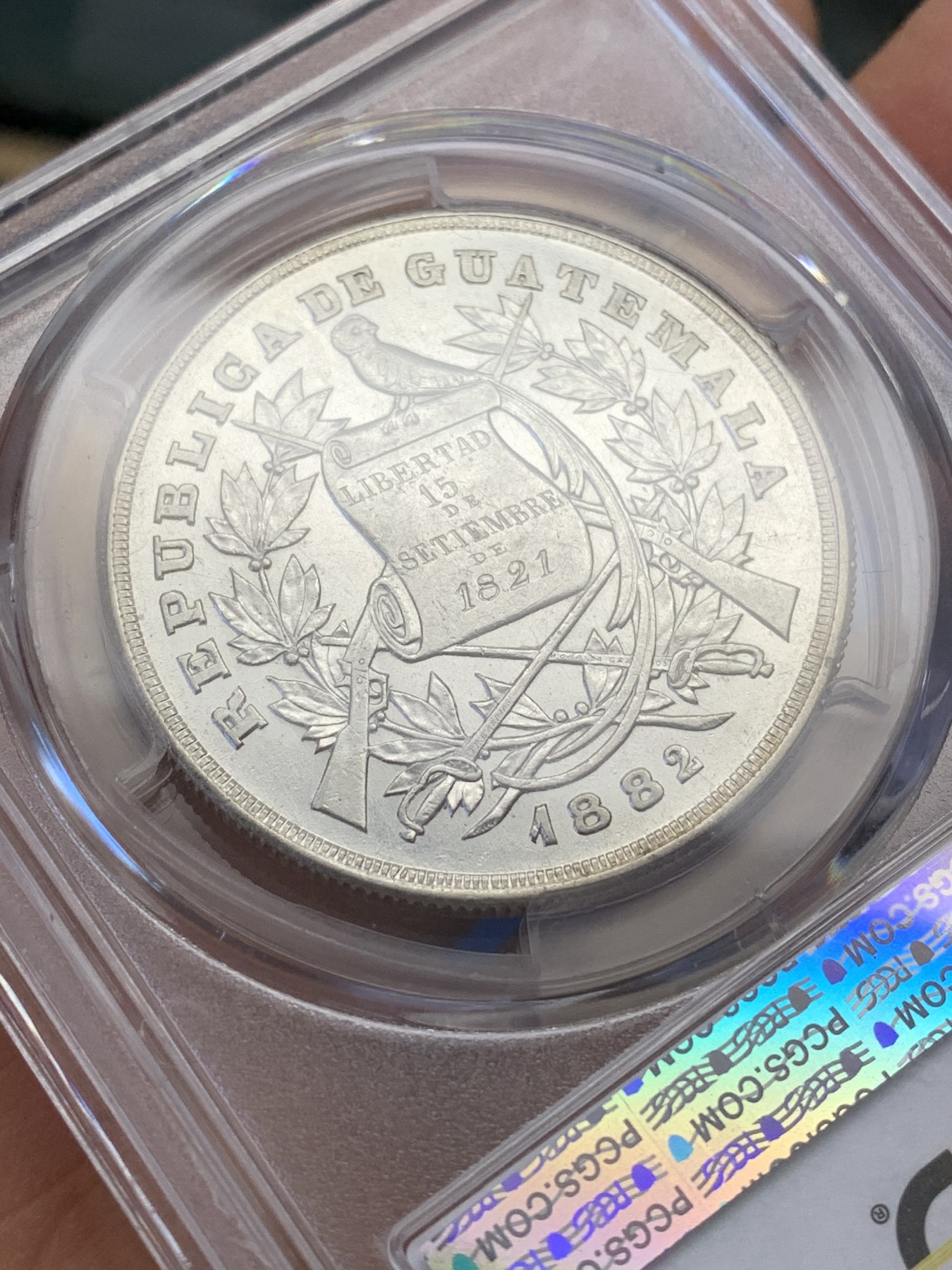 《竞宝斋》圣诞专辑  第二场  第228场 定制纪念章相赠 (全场顺丰包邮) 冠军分 PCGS AU55 危地马拉1882年1比索银币 稀见品种