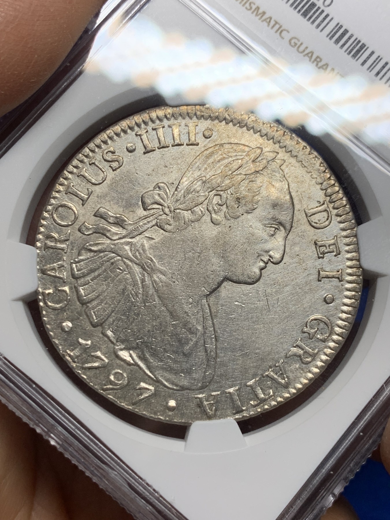 《竞宝斋》圣诞专辑  第二场  第228场 定制纪念章相赠 (全场顺丰包邮) NGC UNC 西属墨西哥1797年MO FM卡洛斯四世双柱8R银币 未流通状态 高性价比 细节见图