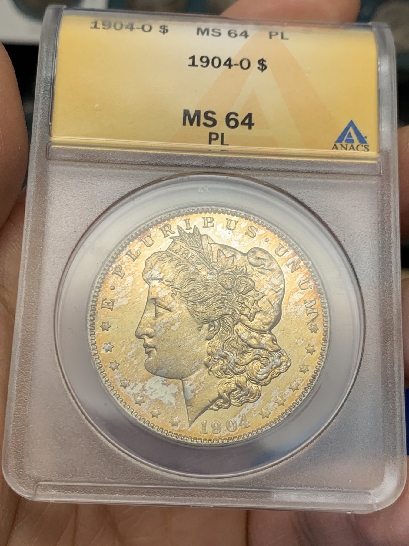 《竞宝斋》圣诞专辑  第二场  第228场 定制纪念章相赠 (全场顺丰包邮) ANACS-MS64PL 美国 1904年 1美元 摩根银币 镜面+金色包浆 可以当镜子的品相