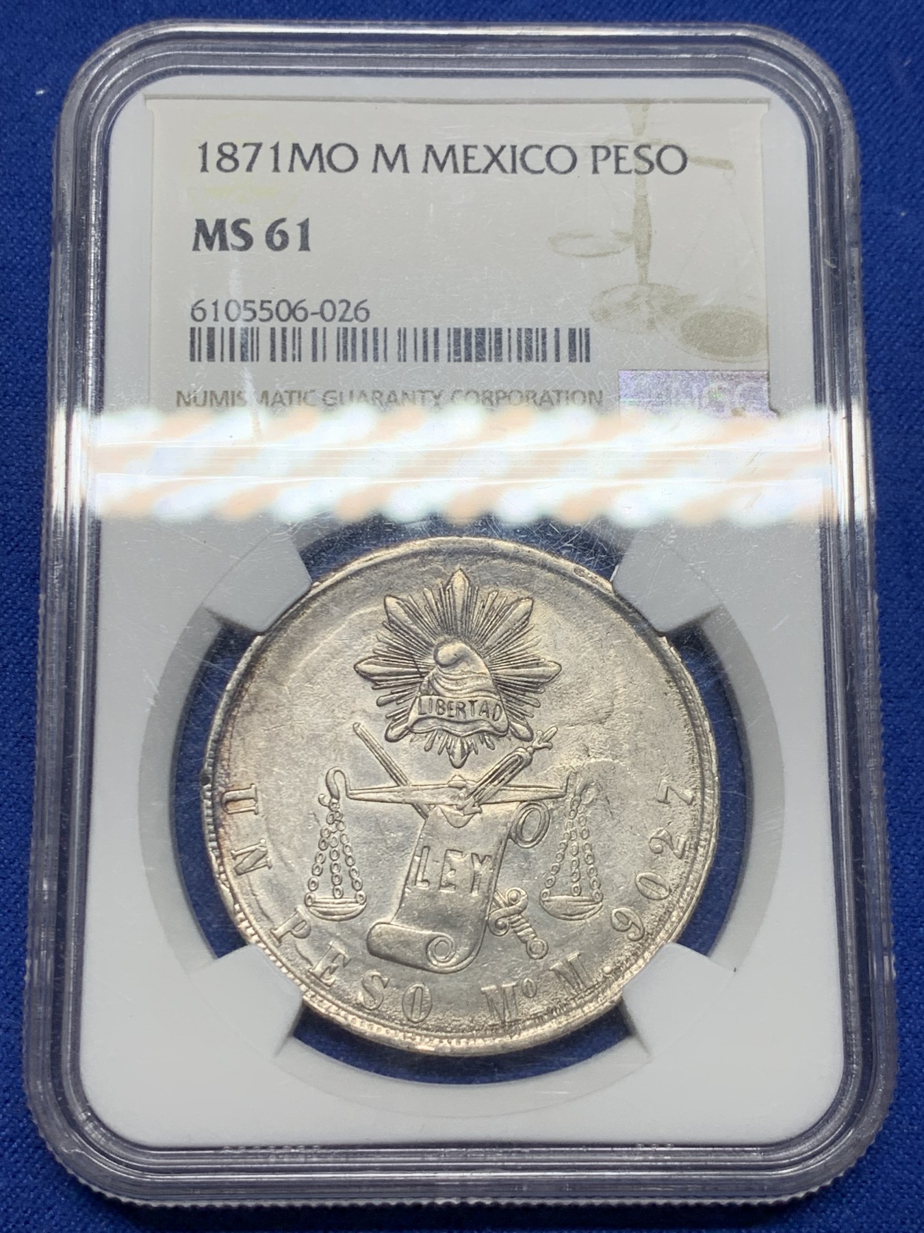 《竞宝斋》圣诞专辑  第二场  第228场 定制纪念章相赠 (全场顺丰包邮) NGC-MS61 墨西哥 1871年天平鹰洋。天平书剑鹰洋是在华流通里的名誉品种，相比自由帽鹰洋，存量非常稀少，这一枚币面正面复打，非常有味道。MS可藏状态非常难得。去年高峰时期同厂同分5000+，今年5月HA成交也在4400以上。