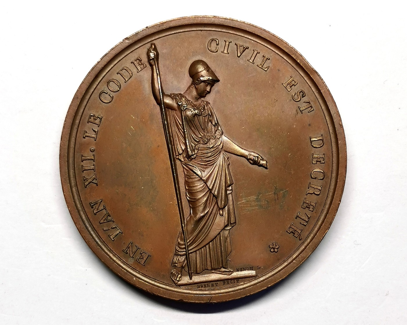 凡希万国世界钱币年度大拍第二季 1803年拿破仑法典颁布纪念铜章，双镜面，极罕底座签名版本，博物馆旧藏，反面依稀可见原藏品编号。原PCGS SP63（39047617）砸盒，官网封面广告章。