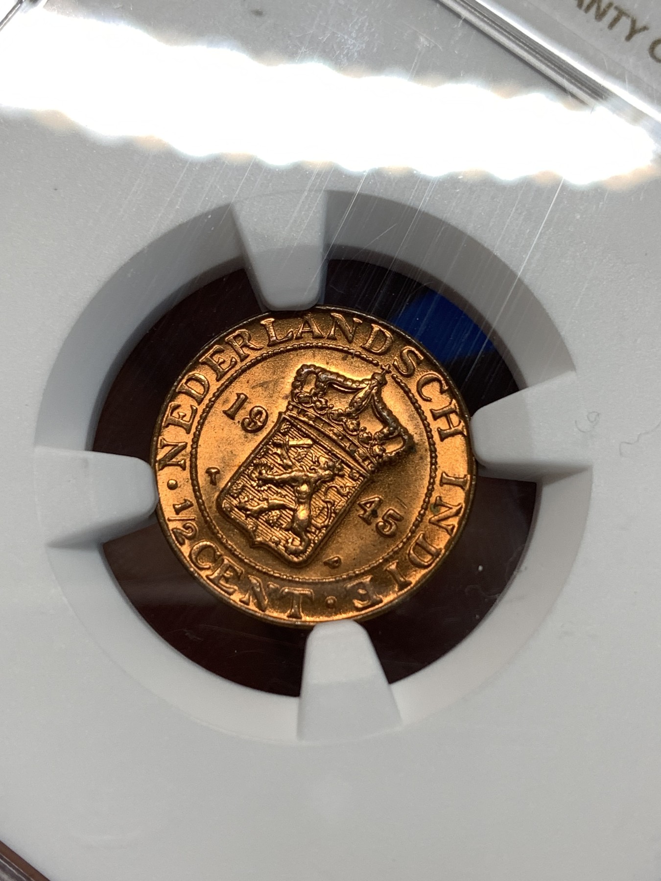 《竞宝斋》第232场-周日，周一 2场 (全场包邮) NGC MS66RD 荷属东印度群岛（今印尼）1945年1/2 半分 铜币 卷拆评级 超高分好品