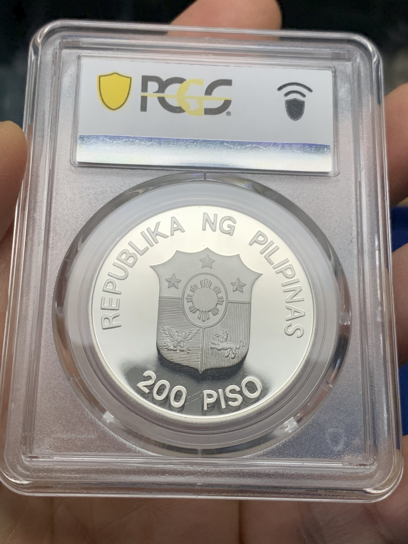 《竞宝斋》第232场-周日，周一 2场 (全场包邮) PCGS金盾 PR69DCAM 菲律宾1987年水牛200比索精制大银币，冠军分