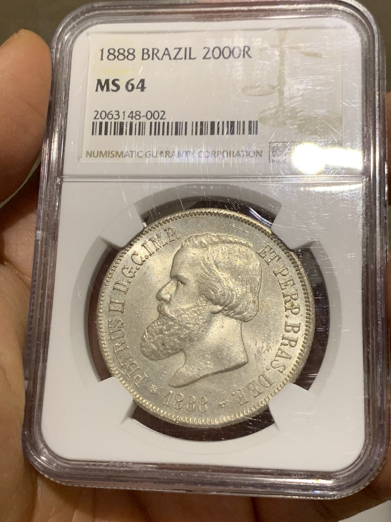 《竞宝斋》第232场-周日，周一 2场 (全场包邮) NGC-MS64 巴西 1888年2000瑞尔 佩德罗二世 大胡子银币 淡黄包浆 MS-64稀有高分一步到位 南美热点品种