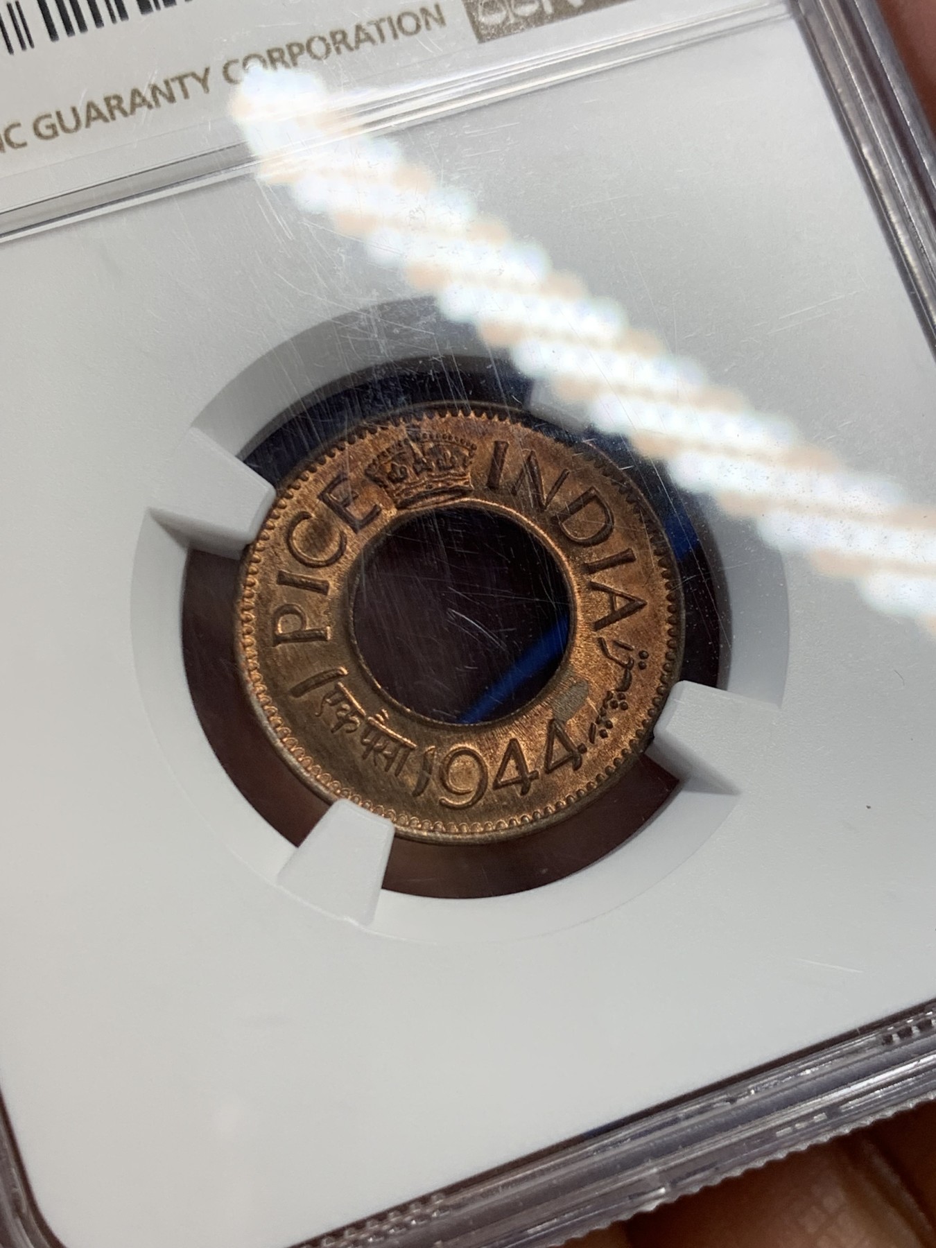 《竞宝斋》第232场-周日，周一 2场 (全场包邮) NGC MS64RB 英属印度1944年南非比勒托利亚厂【P厂】铸造中孔立冠1派沙铜币