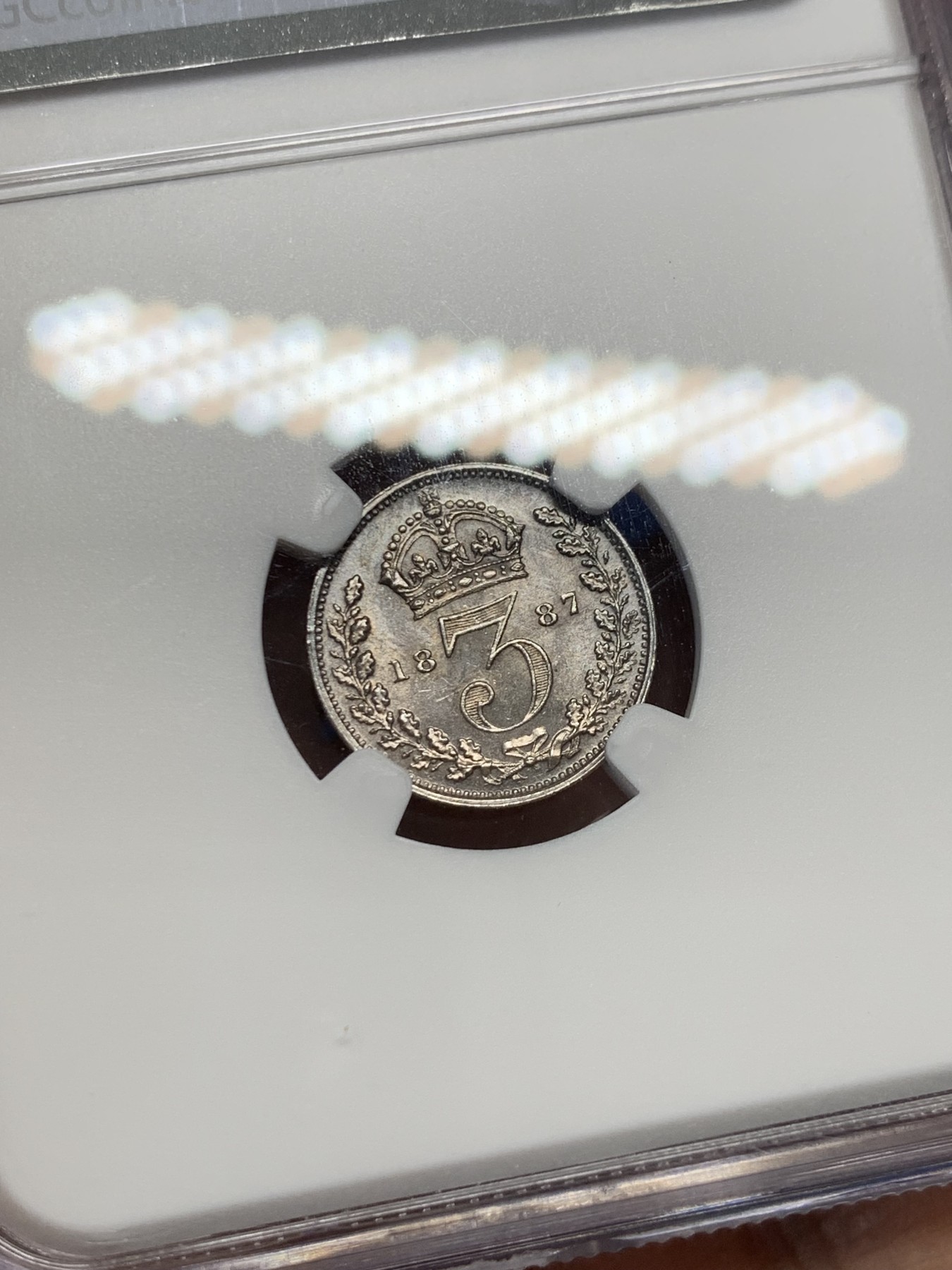 《竞宝斋》第232场-周日，周一 2场 (全场包邮) NGC MS63 1887年维多利亚高冠3便士银币 原味深五彩 带点镜面感 底板丝滑 漂亮的转光