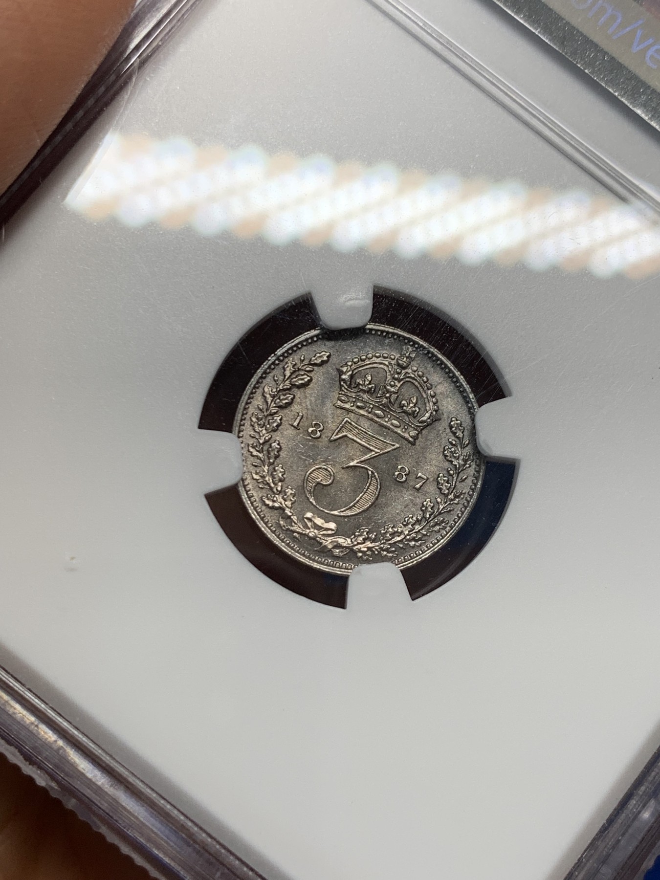 《竞宝斋》第232场-周日，周一 2场 (全场包邮) NGC MS63 1887年维多利亚高冠3便士银币 原味深五彩 带点镜面感 底板丝滑 漂亮的转光