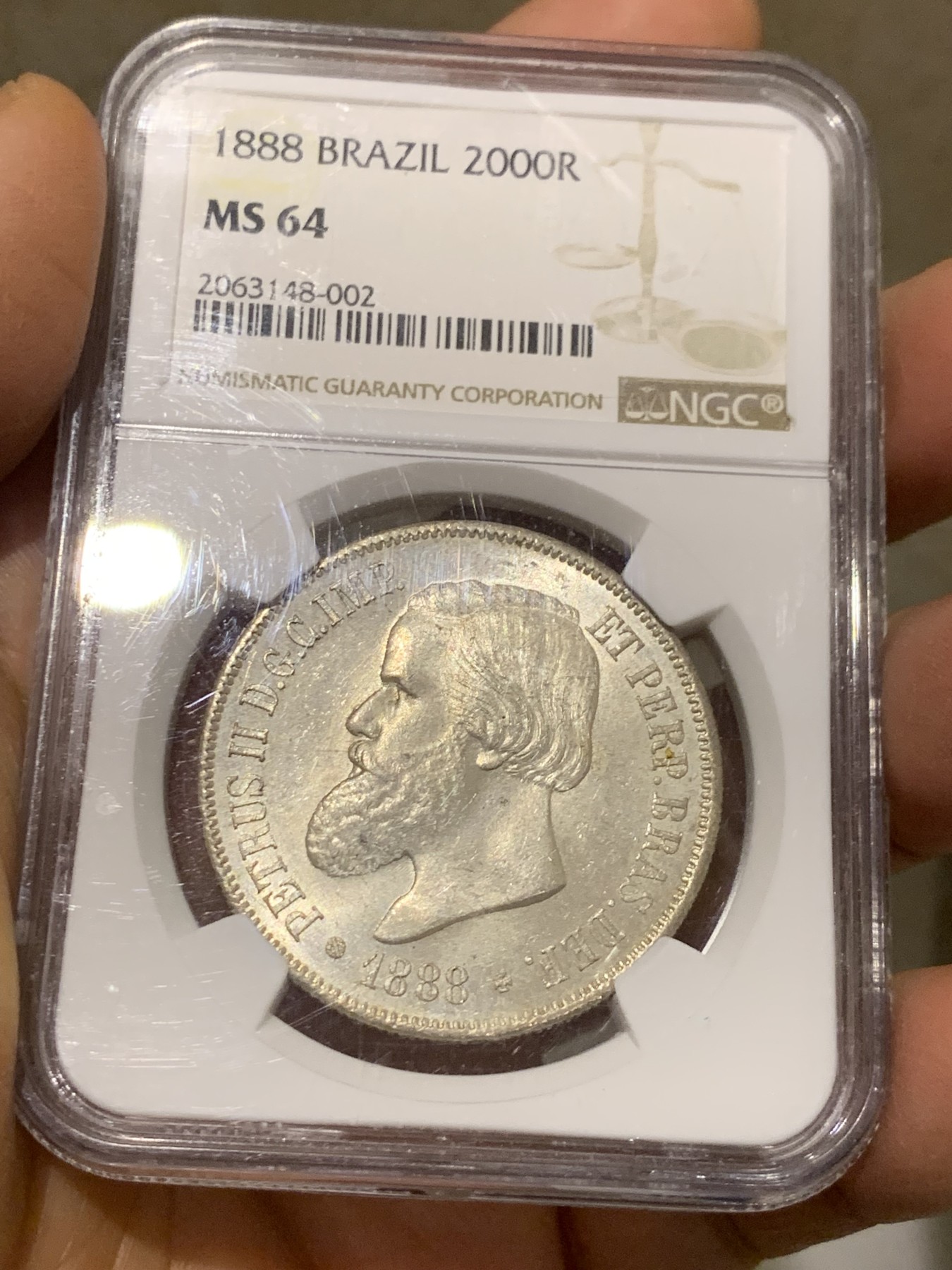 《竞宝斋》第232场-周日，周一 2场 (全场包邮) NGC-MS64 巴西 1888年2000瑞尔 佩德罗二世 大胡子银币 淡黄包浆 MS-64稀有高分一步到位 南美热点品种