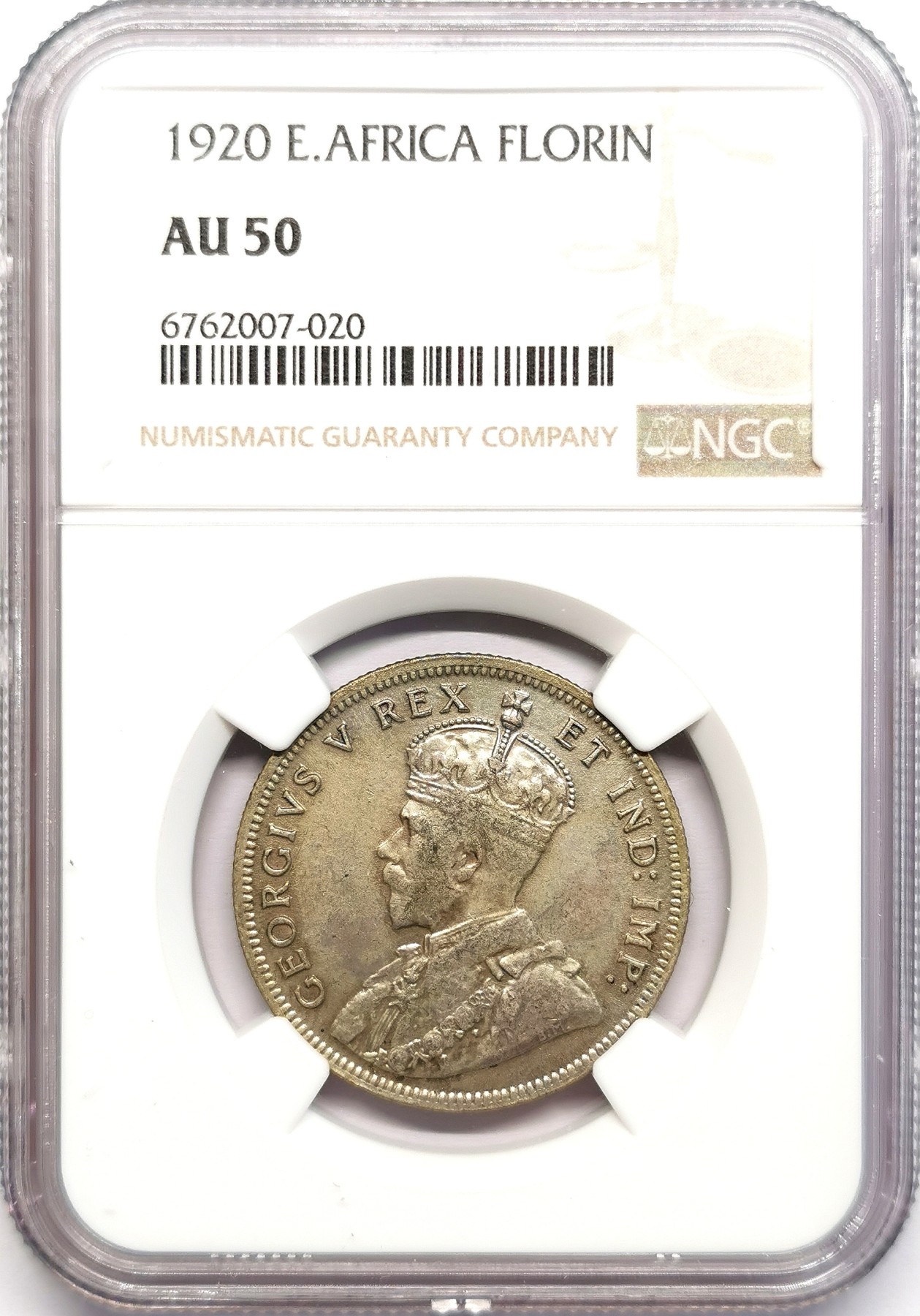凡希社世界钱币微拍第二百五十九期 1920英属东非乔五佛罗林银币NGC-AU50 Royal mint，经典的非洲狮子与草原图案，英国在东非以本土货币体系替代卢比的尝试，FLORIN=RUPEE=100分，但结果不理想，这种含银仅50%的主币不受欢迎被大部回收，留存至今的高品已相当罕见。