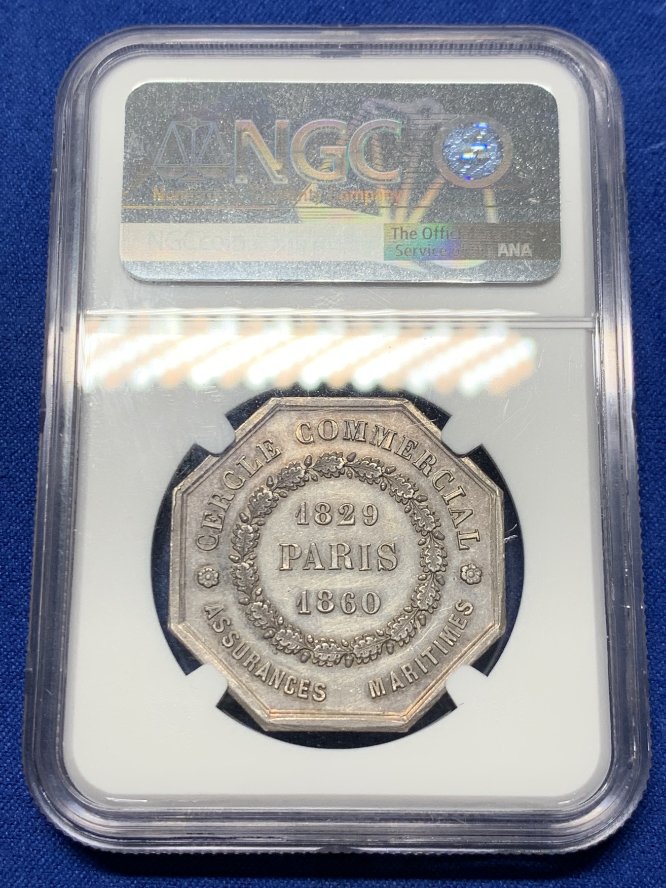 《竞宝斋》第237场- 周日，周一，周二，周日 疯狂4连拍 (全场包邮) NGC-MS61 法国巴黎海上保险公司八角银章，和海妖的背面乘风破浪是同一个作者Caque，略加修改，增加了一艘船，把天上的雨改成了云