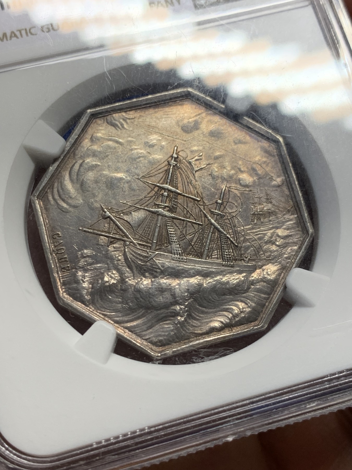 《竞宝斋》第237场- 周日，周一，周二，周日 疯狂4连拍 (全场包邮) NGC-MS61 法国巴黎海上保险公司八角银章，和海妖的背面乘风破浪是同一个作者Caque，略加修改，增加了一艘船，把天上的雨改成了云