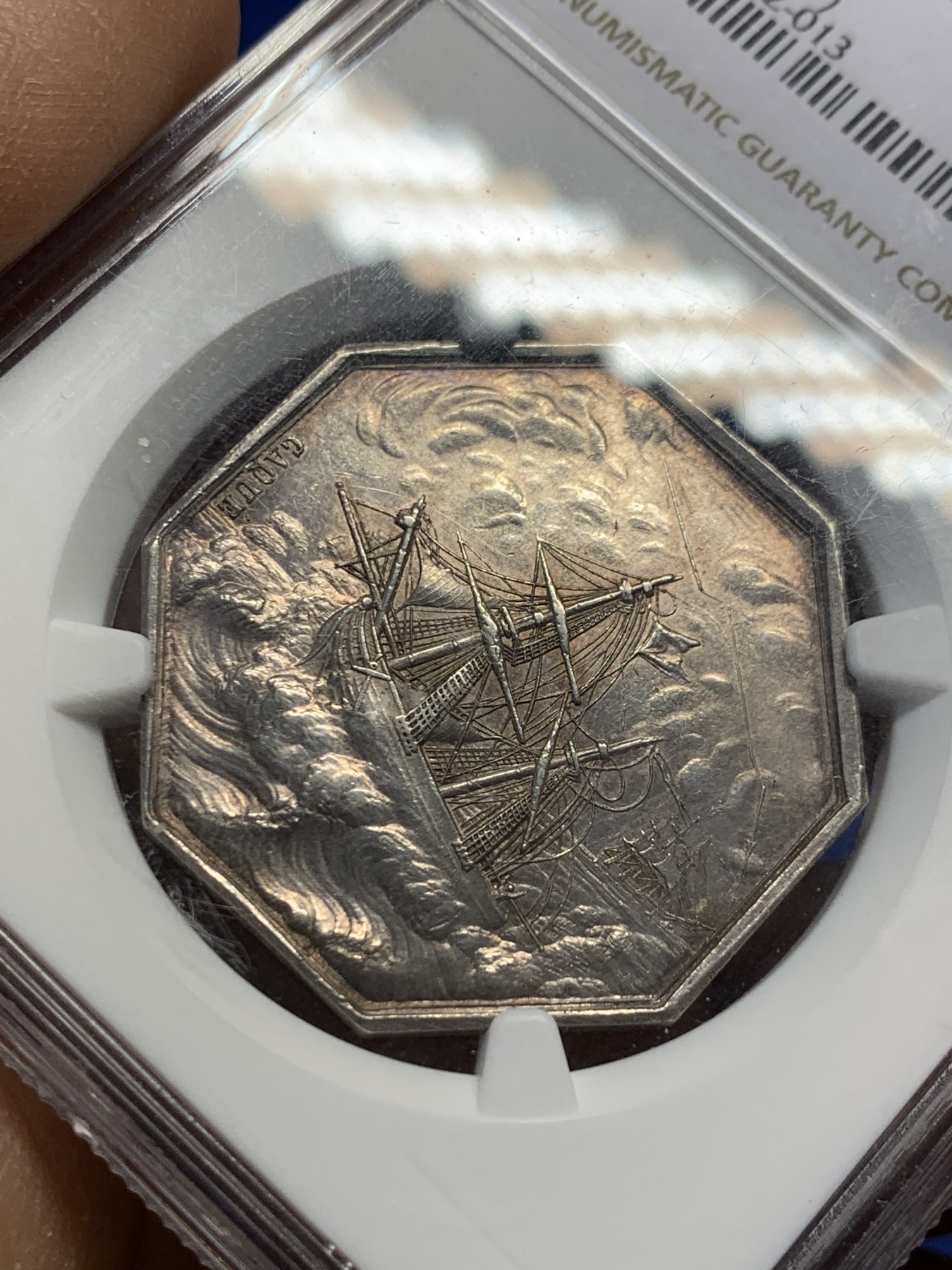 《竞宝斋》第237场- 周日，周一，周二，周日 疯狂4连拍 (全场包邮) NGC-MS61 法国巴黎海上保险公司八角银章，和海妖的背面乘风破浪是同一个作者Caque，略加修改，增加了一艘船，把天上的雨改成了云