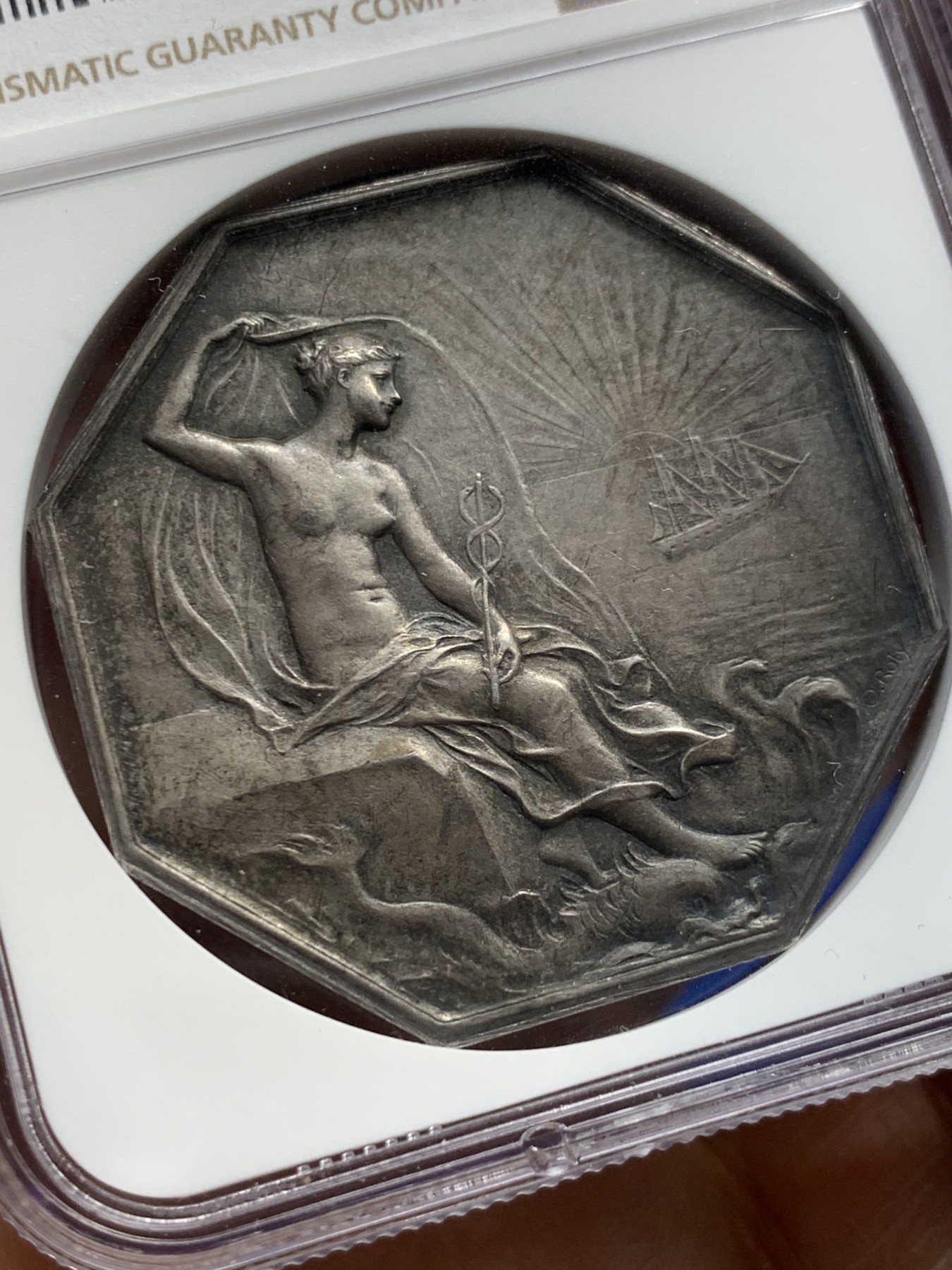 《竞宝斋》第237场- 周日，周一，周二，周日 疯狂4连拍 (全场包邮) NGC-MS62 法国大师O.ROTY 1879年圣纳泽尔商会八角银章，42mm，近40克大规格，水手和渔民的保护神海仙女涅瑞斯手持权杖，脚下是其坐骑海豚，庇护着海港城市圣纳泽尔的船只一帆风顺