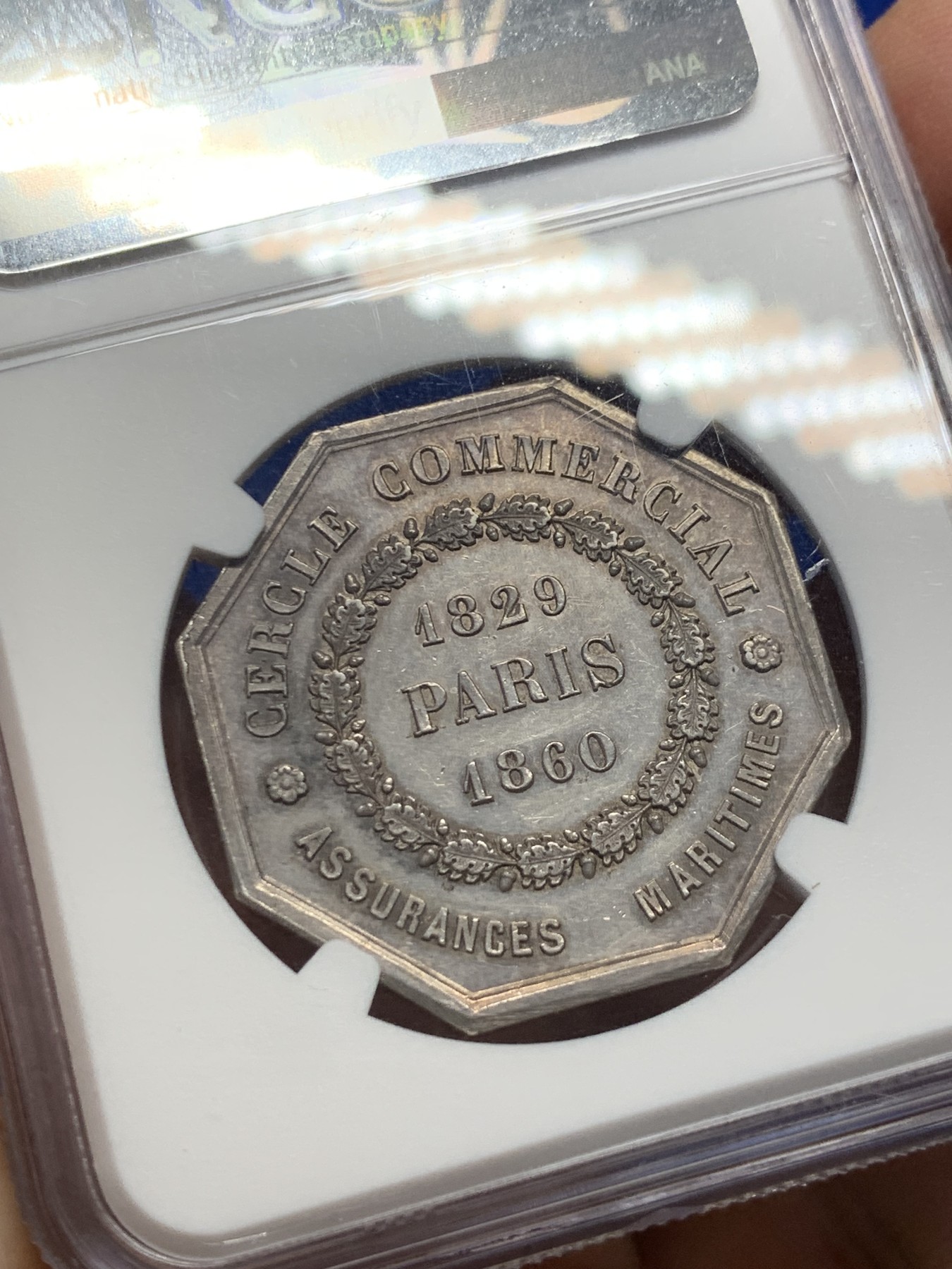 《竞宝斋》第237场- 周日，周一，周二，周日 疯狂4连拍 (全场包邮) NGC-MS61 法国巴黎海上保险公司八角银章，和海妖的背面乘风破浪是同一个作者Caque，略加修改，增加了一艘船，把天上的雨改成了云