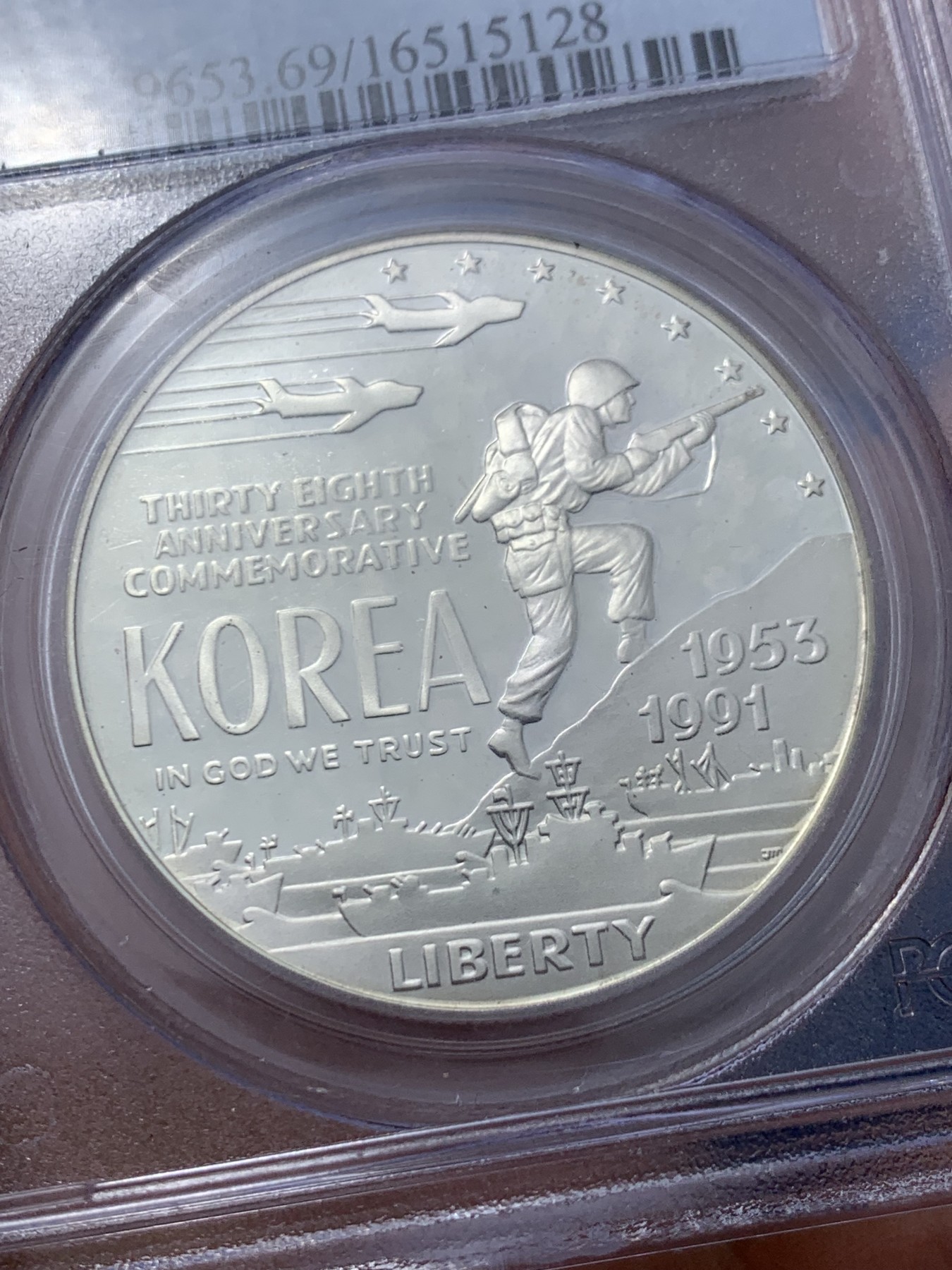 《竞宝斋》第235场-周日，周一，周二，周三 疯狂4连拍 (全场包邮) PCGS-PR69 美国1991年朝战结束38周年纪念银币，正面是海陆空三军，背面是朝韩地图。这种具有历史意义的收藏品由美国造币厂生产，专门设计和制造的，以纪念那些在朝战中服役的人。PROOF镜面状态精制币，PC盒经典小白盒老盒。