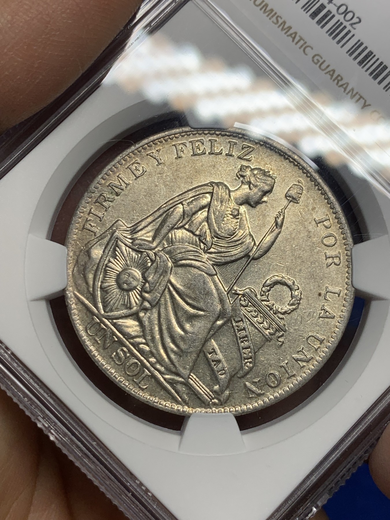 《竞宝斋》第235场-周日，周一，周二，周三 疯狂4连拍 (全场包邮) NGC-AU58 秘鲁1934年坐洋自由女神一索尔银币，原汁原味老包浆，极美黄油彩，状态极佳，非常漂亮，南美洲主币。略为低评，品质和状态绝对不输MS级，获得更高的评分数目才91枚。