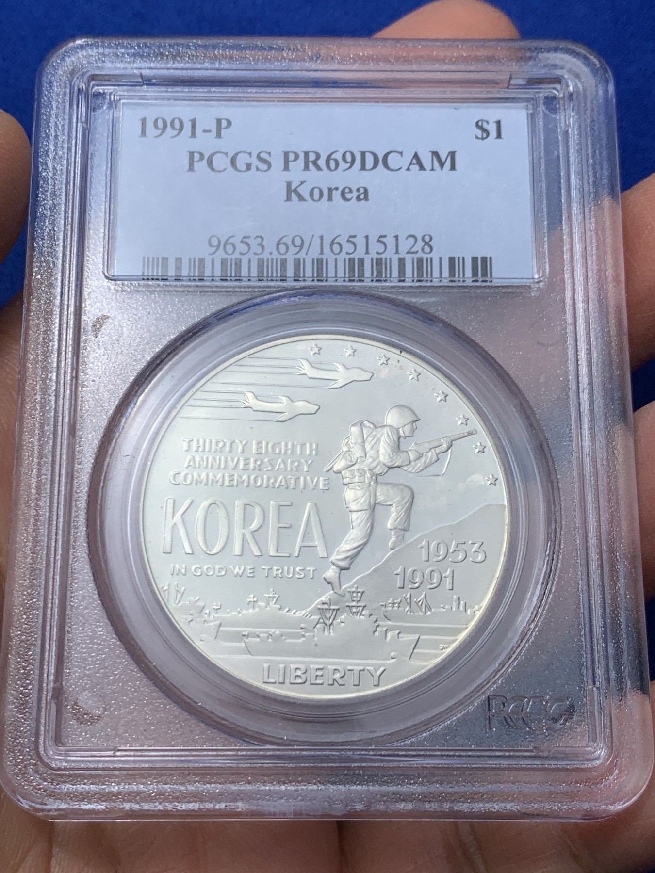 《竞宝斋》第235场-周日，周一，周二，周三 疯狂4连拍 (全场包邮) PCGS-PR69 美国1991年朝战结束38周年纪念银币，正面是海陆空三军，背面是朝韩地图。这种具有历史意义的收藏品由美国造币厂生产，专门设计和制造的，以纪念那些在朝战中服役的人。PROOF镜面状态精制币，PC盒经典小白盒老盒。