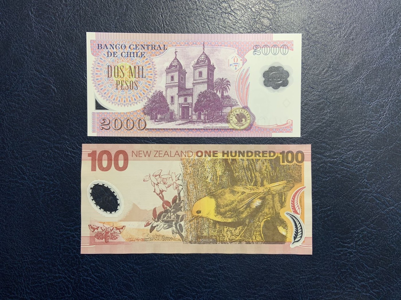 收藏联盟Quantum Auction 第320期拍卖  智利2004年2000比索和新西兰1999年100元 品相为全新UNC和AU-