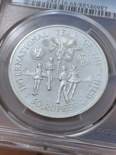 《竞宝斋》第239场-周日，周一 年终拍场 (全场包邮) PCGS-PR68 塞舌尔1980年国际儿童年50卢比精制纪念银币，925银，发行量1万枚。PROOF精制币，镜面状态，获得更高评级数量6枚。