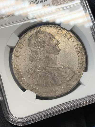 《竞宝斋》第239场-周日，周一 年终拍场 (全场包邮) NGC-MS62 玻利维亚 1808年 卡洛斯四世 8里亚尔银币 灰色五彩包浆 压力十足 底板PL感 状态非常好