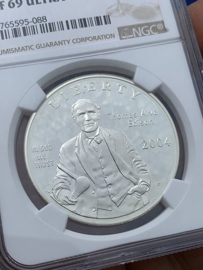 《竞宝斋》第239场-周日，周一 年终拍场 (全场包邮) NGC PF69 美国2004年爱迪生发明电灯125周年精致纪念银币 06年克劳斯最具历史意义币
