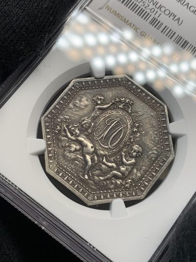 《竞宝斋》第239场-周日，周一 年终拍场 (全场包邮) NGC MS61 法国八角银质代币，皇家婚姻，小名誉品三个小天使，状态非常好，黑色包浆难得