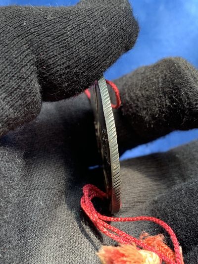 《竞宝斋》第239场-周日，周一 年终拍场 (全场包邮) 安南明命通宝飞龙七钱银币 穿孔带流苏 宫廷赏赐用