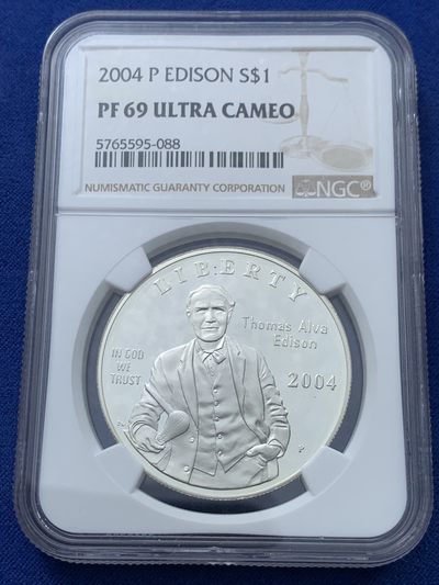 《竞宝斋》第239场-周日，周一 年终拍场 (全场包邮) NGC PF69 美国2004年爱迪生发明电灯125周年精致纪念银币 06年克劳斯最具历史意义币