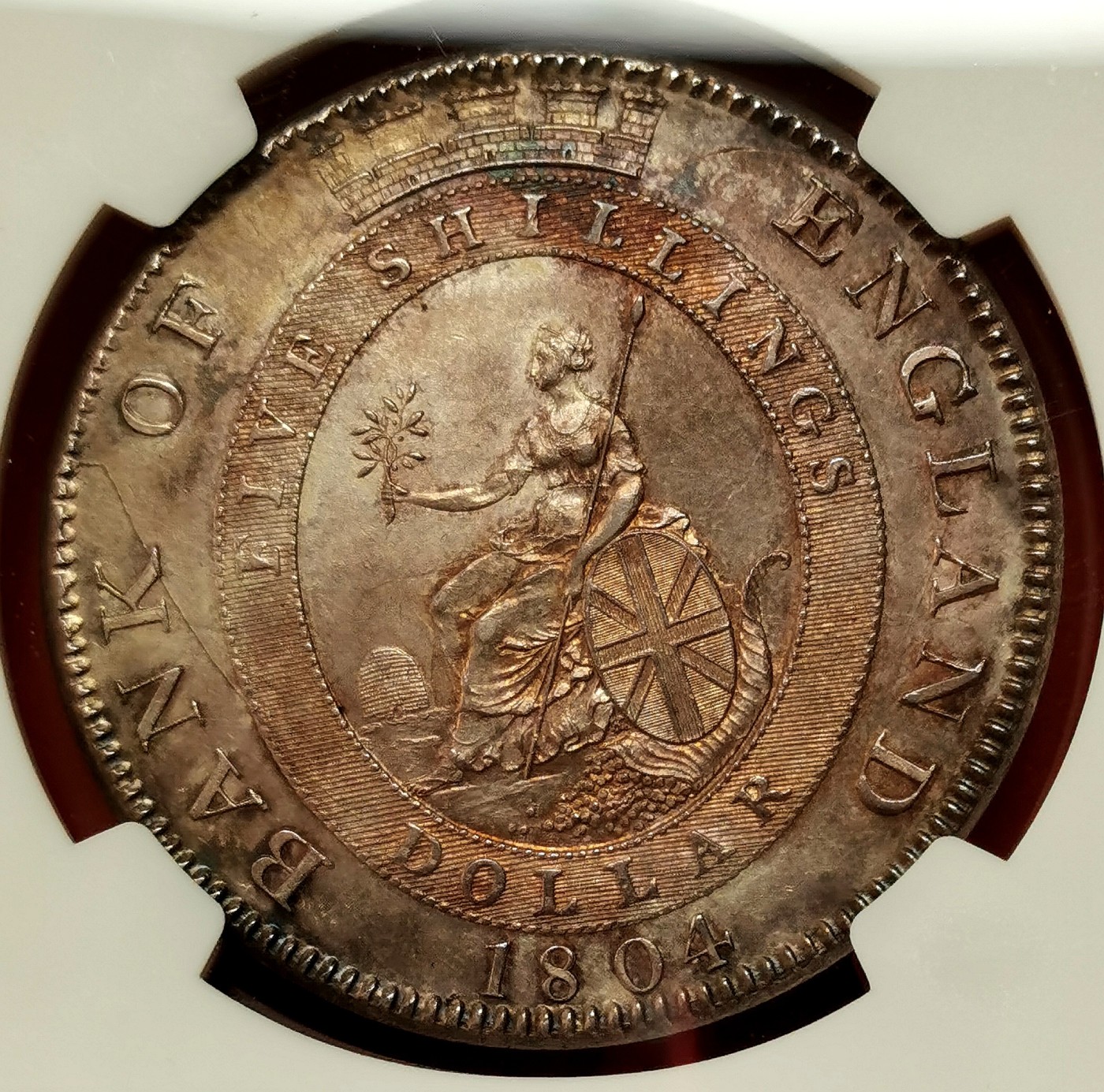 凡希社世界钱币微拍第二百六十期 荐！1804英格兰银行乔三dollars(5先令)大银NGC-MS61 复压在墨西哥双柱上，细节可说完美，双面洋红包浆更添迷人魅力，SOHO出品的具有重要铸造史和货币史价值的样本！ 