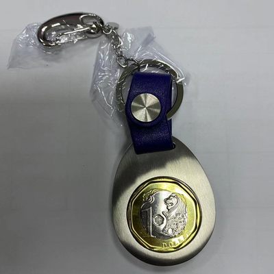 康怡轩钱币【新加坡+不丹+澳门+帕劳+美国+蒙古 纪念币专场】第251010期  2017年新加坡第三系列1元硬币银色不锈钢加蓝色皮条钥匙扣