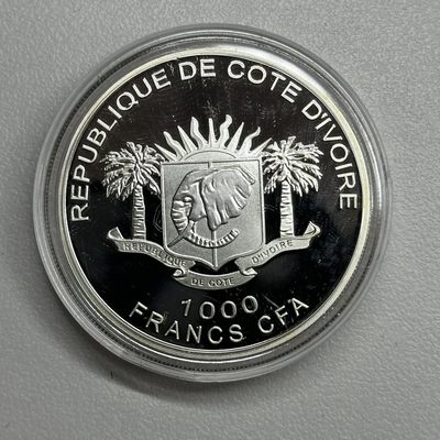 康怡轩钱币【安道尔+西班牙+拉脱维亚+刚果+瑞士+奥地利 纪念币专场】第251014期 2010年科特迪瓦发行希望大陆镶施华洛世奇水晶彩色纪念银币  有证无盒  1枚