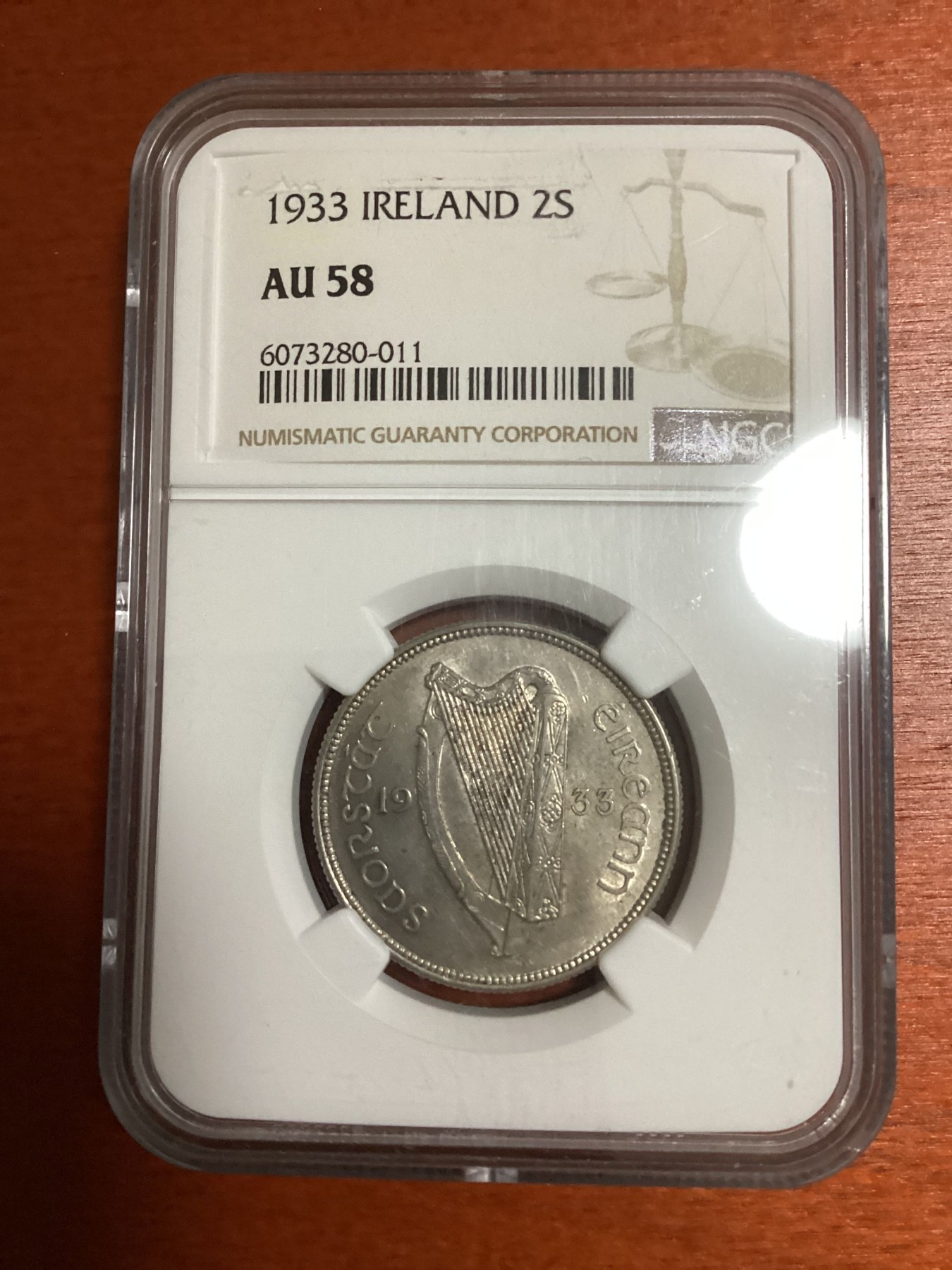长老汇兔年精选第二场 1933 IRELAND爱尔兰自由邦2先令鳟鱼银币，NGC AU58分，难出分品种，NGC官网60分标价650美元