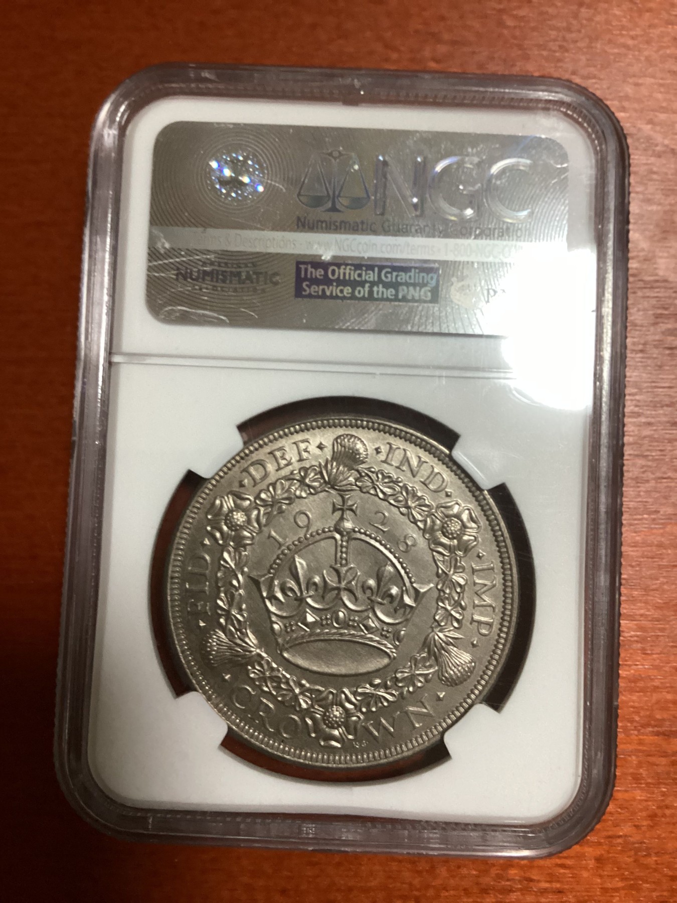 长老汇兔年精选第二场 1928 英国乔治五世花冠1克朗大银币，NGC MS63分