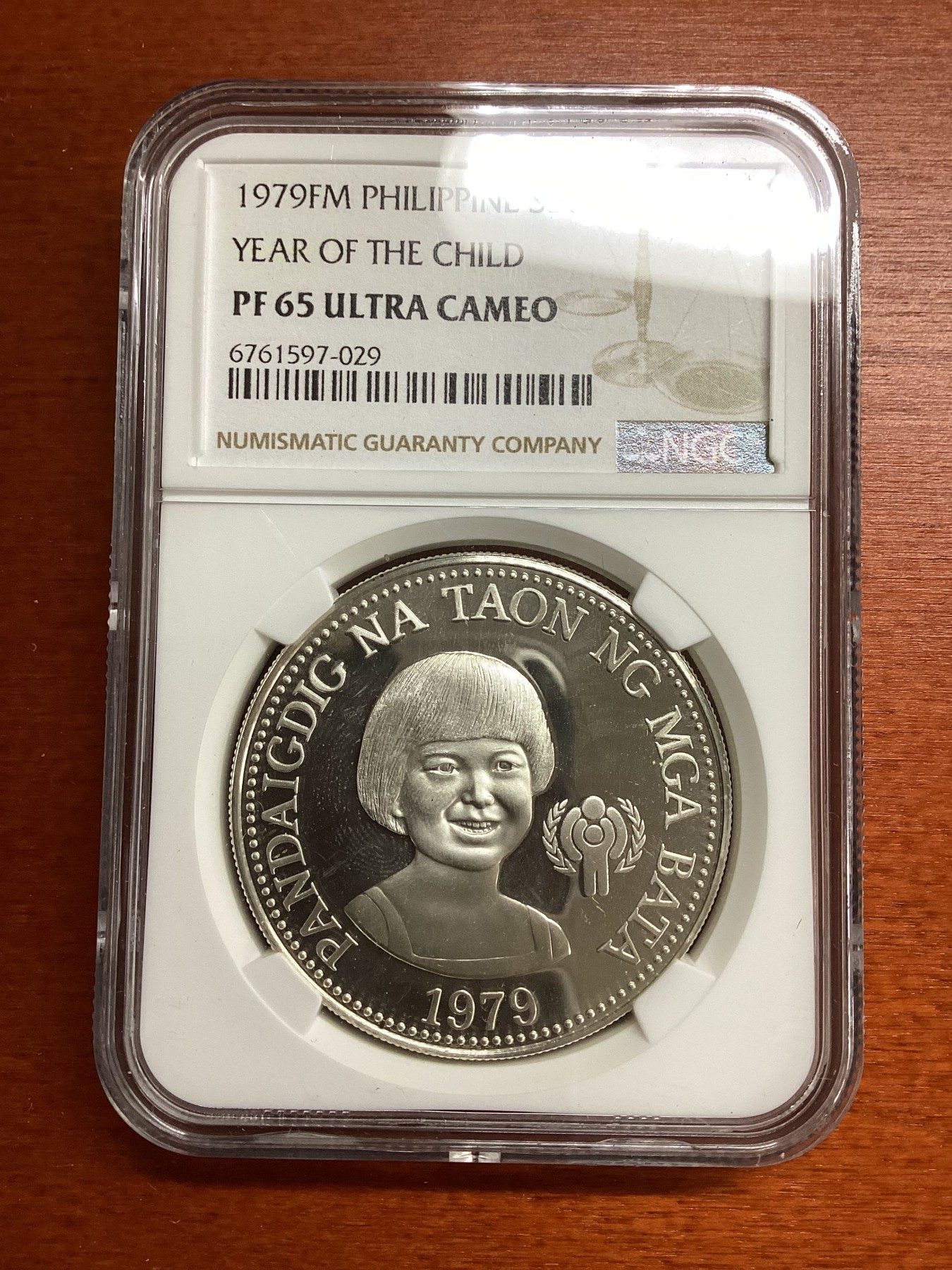 长老汇兔年精选第二场 1979FM 菲律宾国际儿童年50比索精制银币，NGC PF65UC