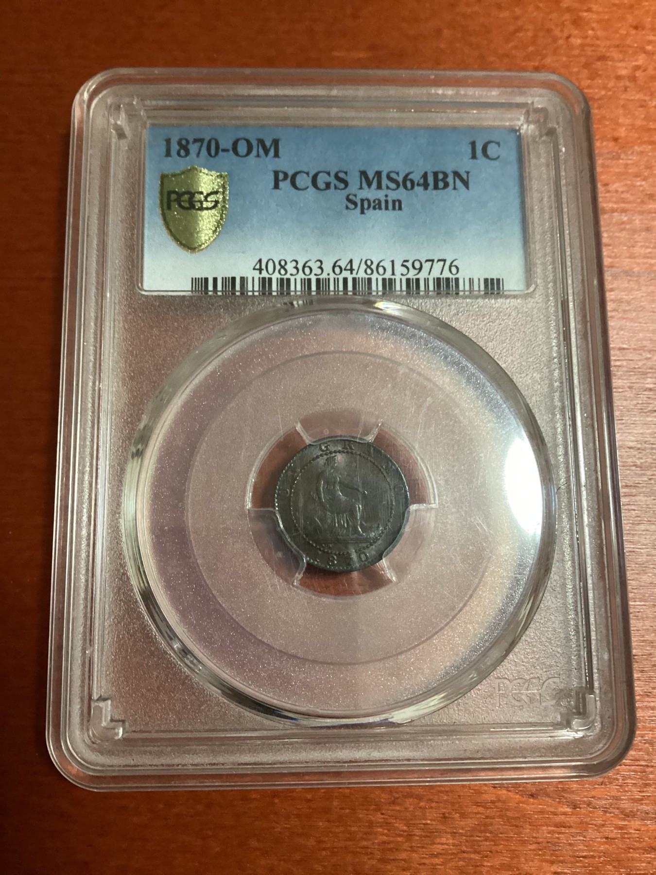 长老汇兔年精选第二场 1870-OM 西班牙地方省1分铜币，PCGS MS64BN，亚军分，更高分仅有6枚，同分16年SB成交价1000多元