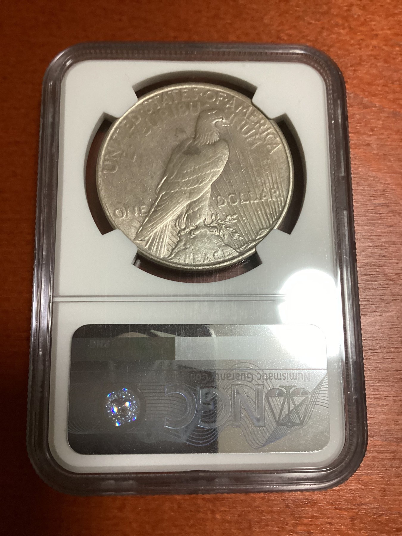 长老汇兔年精选第二场 1935美国和平1美元银币，NGC AUC，特年