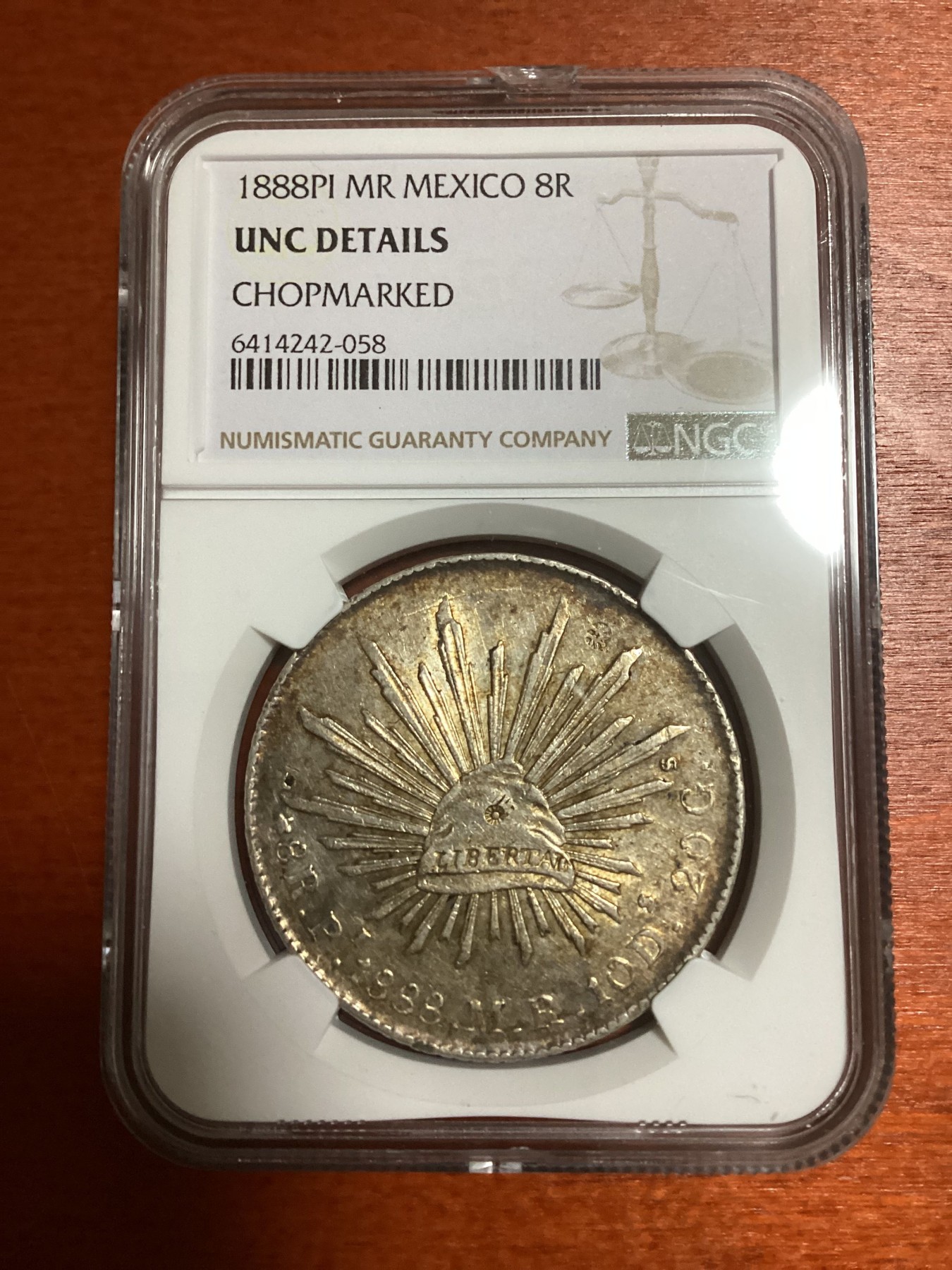 长老汇兔年精选第二场 1888PI MR 墨西哥鹰洋8R银币，NGC UNC， 中间有个戳记，否则状态超过许多65分
