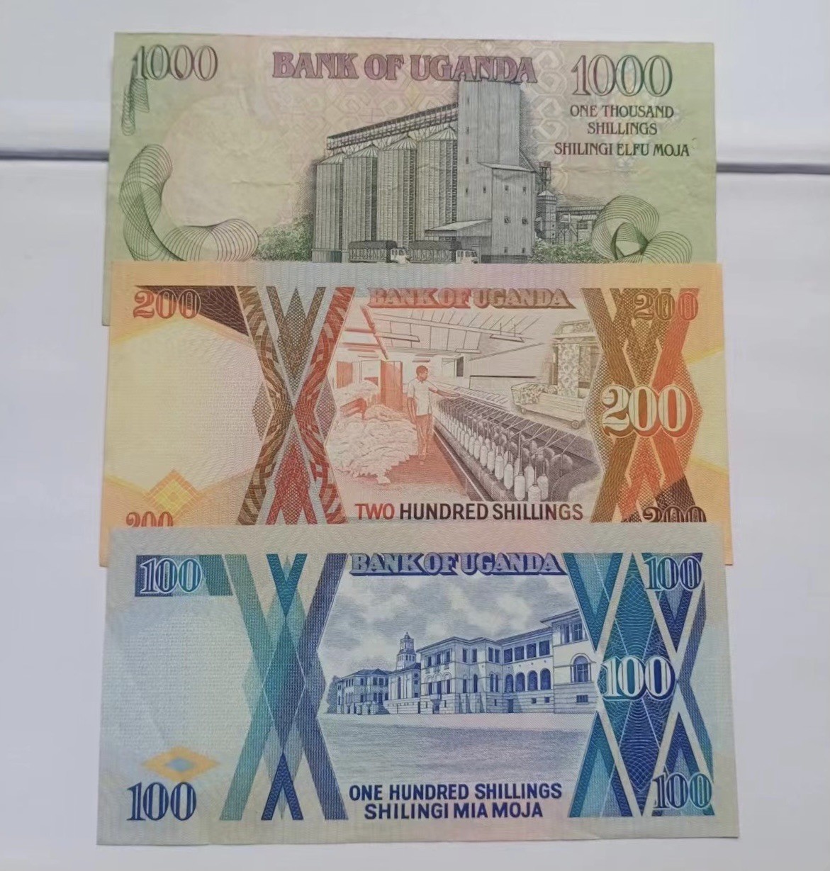 🦩收藏联盟Quantum Auction 第324期拍卖  加纳1000-10000塞地和乌干达100-1000先令两套 非全新  品相如图