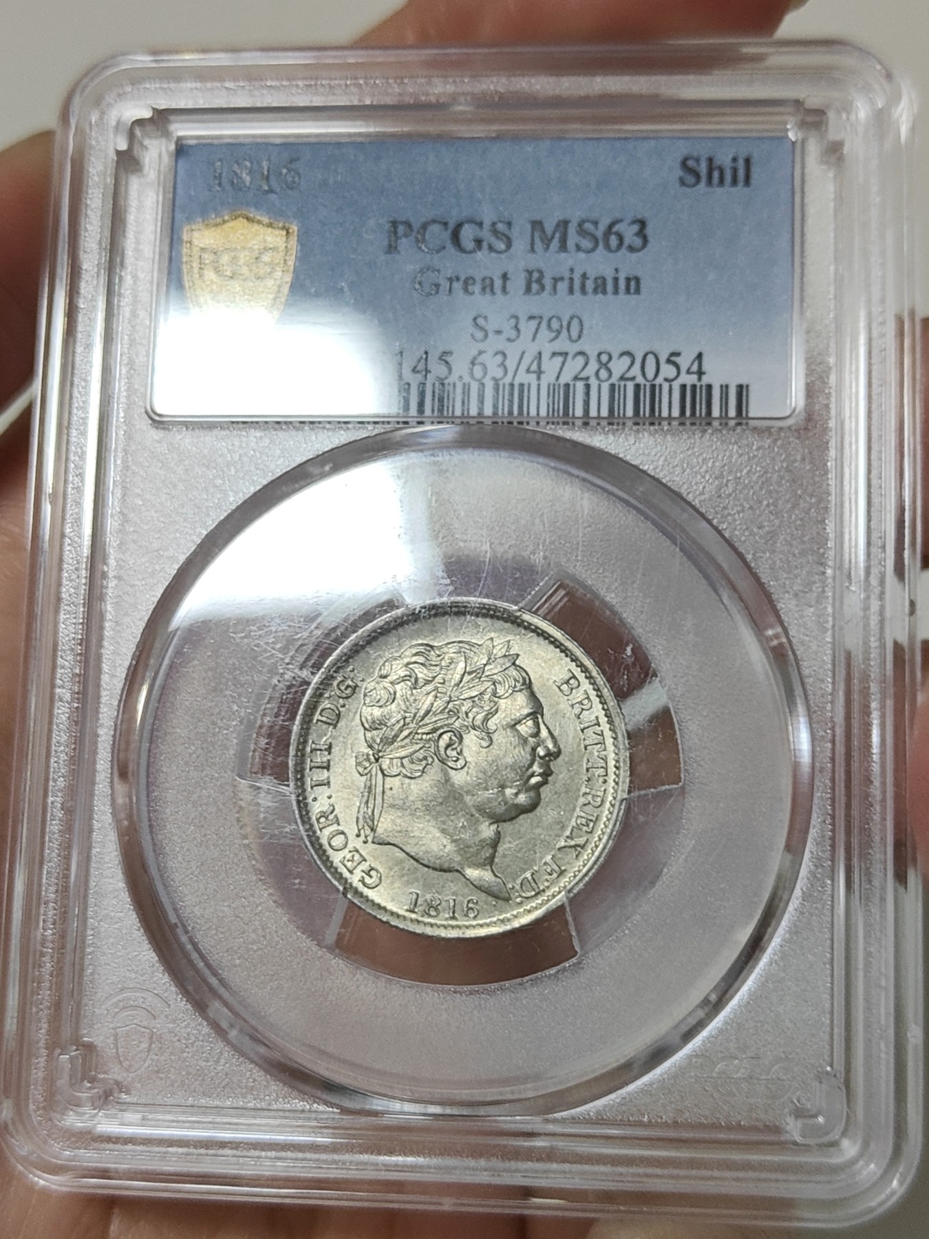 🏮💰物与斋新春连拍3-世界近现代硬币专场（共三场合并发货） PCGS-MS63 英国1816年乔治三世牛头先令银币，淡黄油彩，盒子正面略有磨损如图