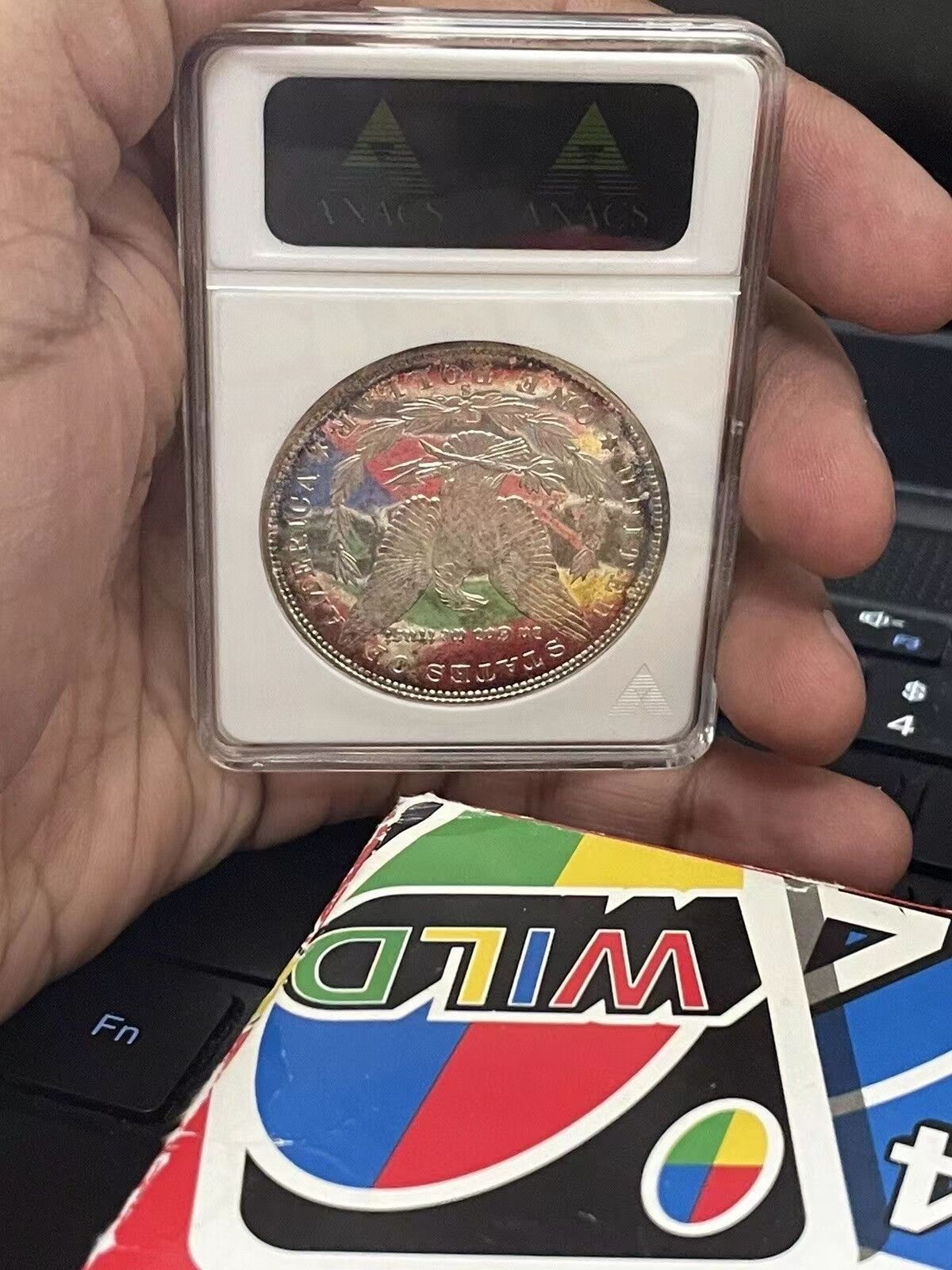 万国钱币拍卖第021期（龙年首拍） ANACS MS66DMPL 1880年美国摩根女神银元1美元 极致环彩+深度镜面 ANACS老盒难得