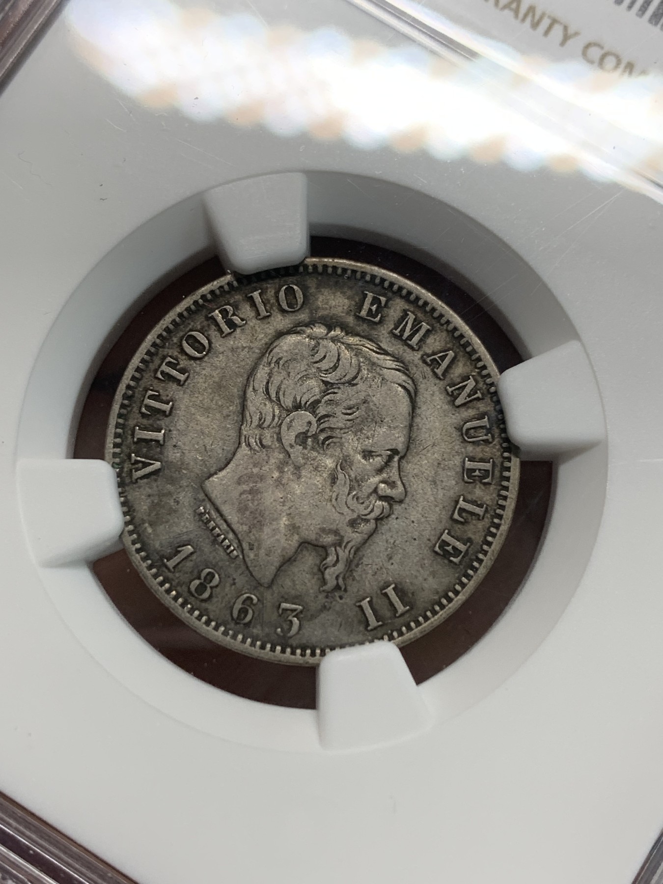 《竞宝斋》第242场-周日，周一 新年开场 (全场包邮) NGC-XF40 意大利1863年伊曼纽尔二世 米兰造币厂 背面值版1里拉银币 清一色欧洲包浆 相对于普通的背盾徽版非常少见 书价是普通版本的7倍 好品价格更高