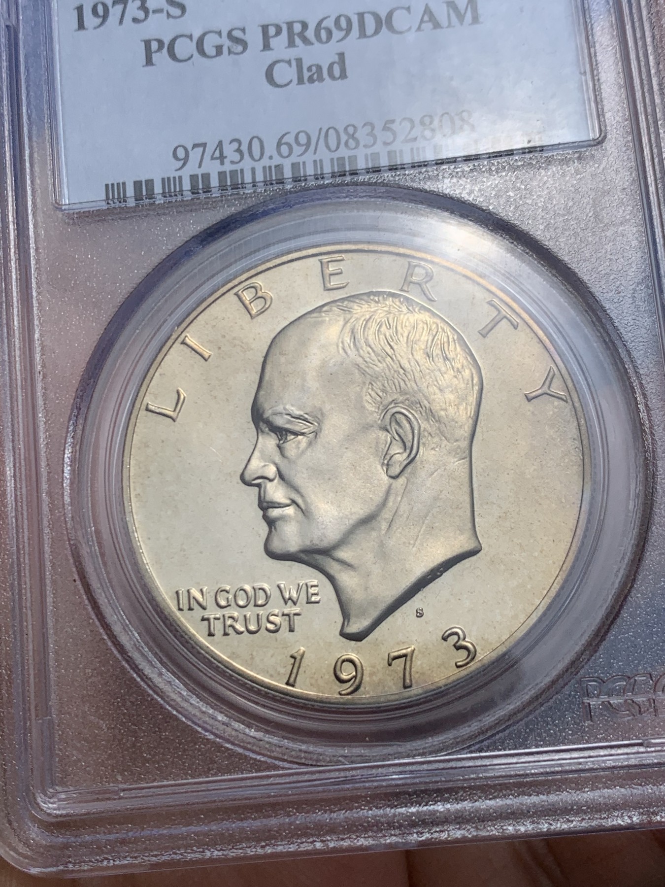 《竞宝斋》第242场-周日，周一 新年开场 (全场包邮) PCGS-PR69DCAM 1973年美国艾森豪威尔1美元精制币，直径38mm，重22.8克，状态极佳，PC早期经典小白盒老盒无官网图，更高评级数量55枚。