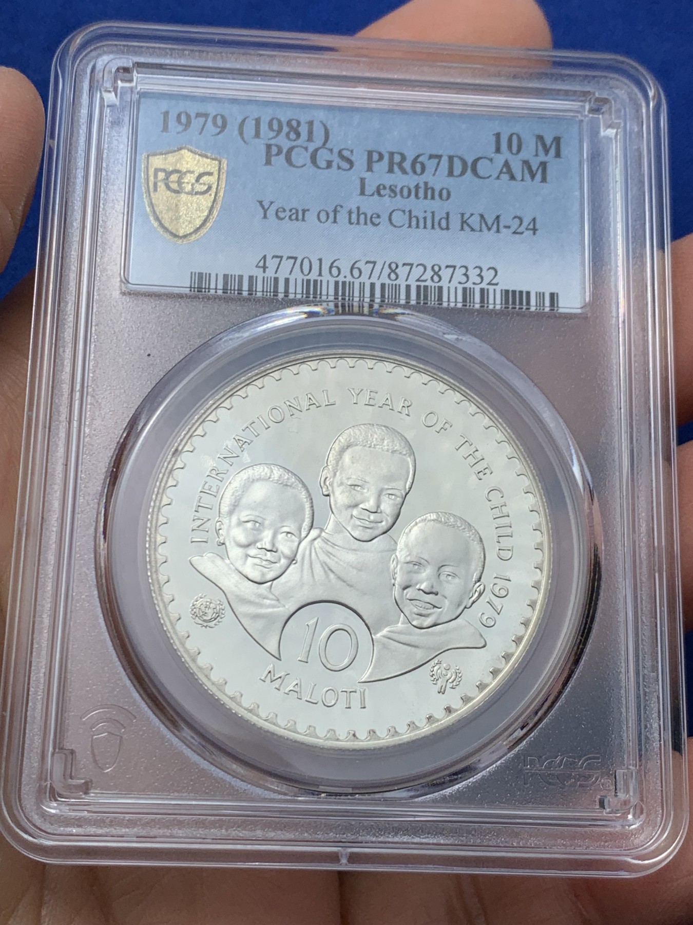 《竞宝斋》第242场-周日，周一 新年开场 (全场包邮) PCGS金盾 PR67DCAM 莱索托1979年儿童年纪念10洛蒂精制大银币，会清理的清理一下能出高分