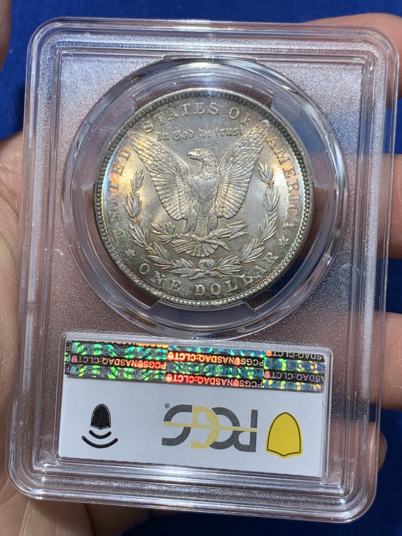 《竞宝斋》第243场-周日，周一 新年开场 (全场包邮) PCGS MS64 美国1889年摩根银币P版，极美原汁原味五彩包浆，包浆醇厚浓郁，打制精美，状态一流。币面五彩斑斓，炫耀夺目，状态和品质不输现在的65分，市场上稀少年份版本的摩根币。