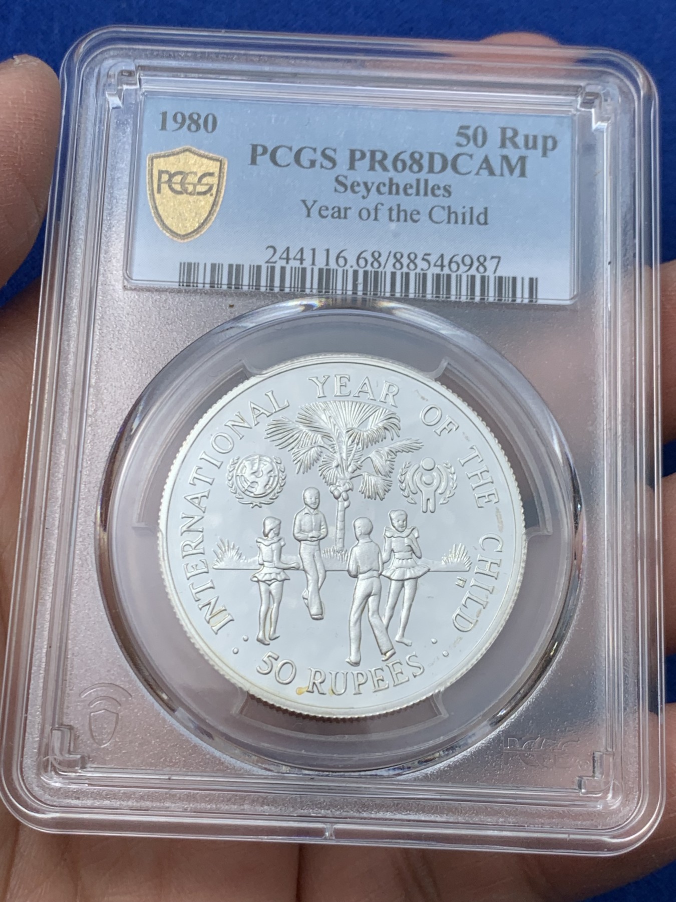 《竞宝斋》第243场-周日，周一 新年开场 (全场包邮) PCGS PR68 塞舌尔1980年国际儿童年50卢比精制纪念银币，925银，发行量1万枚。PROOF精制币，镜面状态，获得更高评级数量6枚。