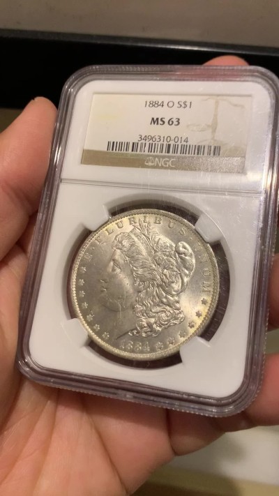 《竞宝斋》第243场-周日，周一 新年开场 (全场包邮) NGC MS63 美国1884年摩根银币 O版 淡淡黄油光 正面那道是包浆印子 不是划痕 年年上涨品种